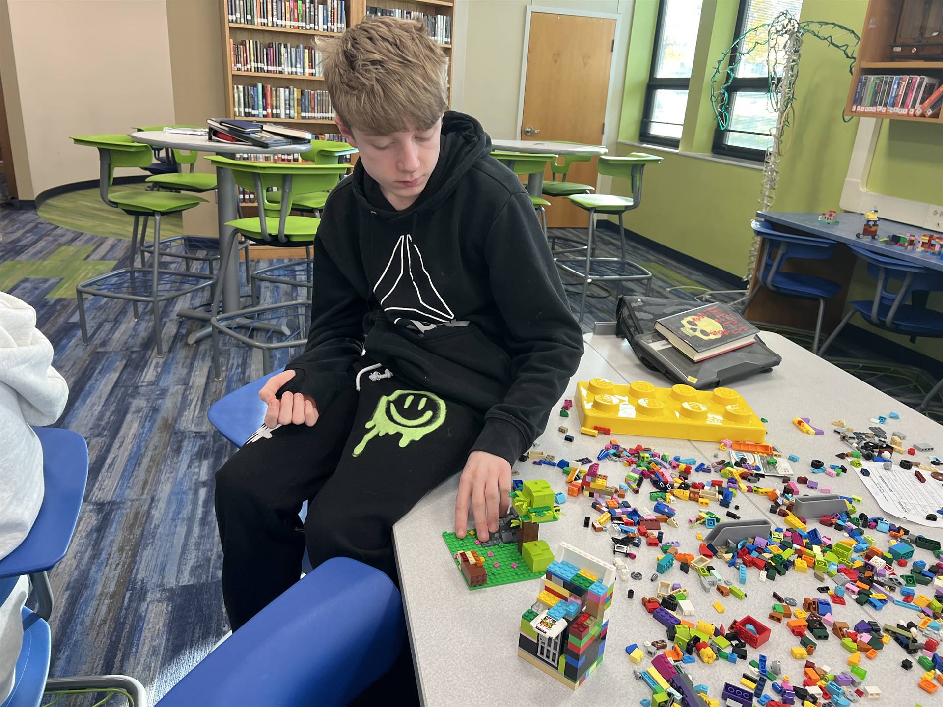 Sharpsville High School students work on a STEAM project in the media center