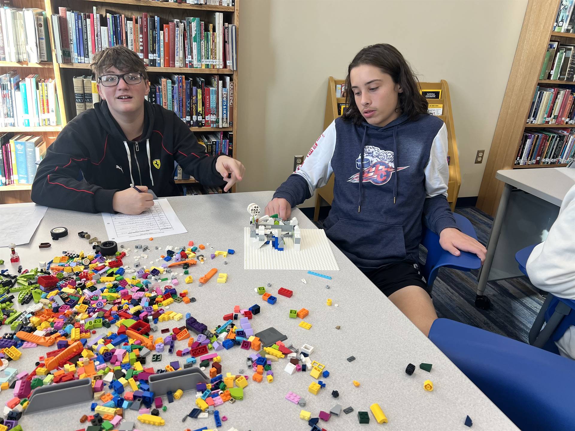 Sharpsville High School students work on a STEAM project in the media center
