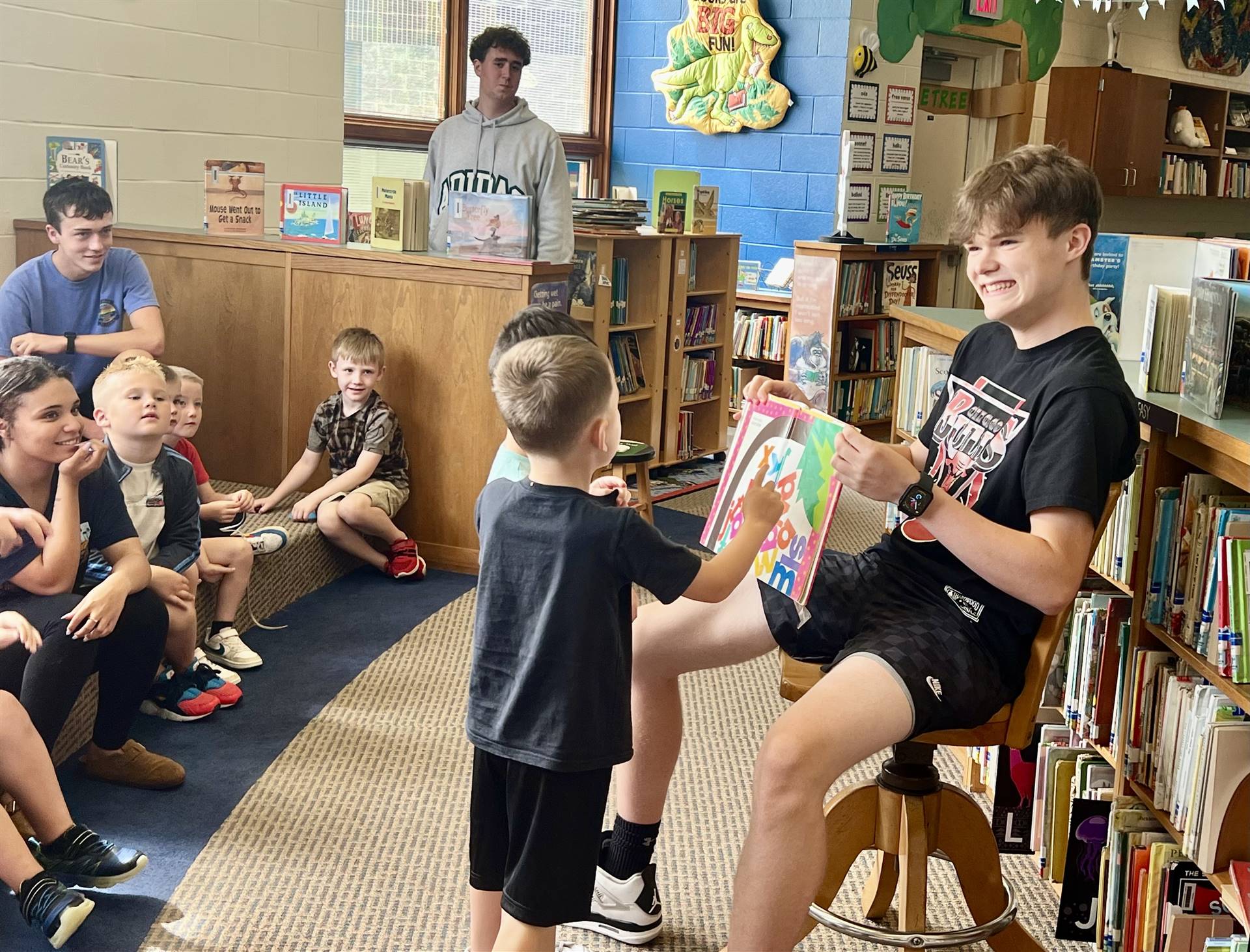 Sharpsville High School students read stories and interact with Sharpsville Elementary School studen