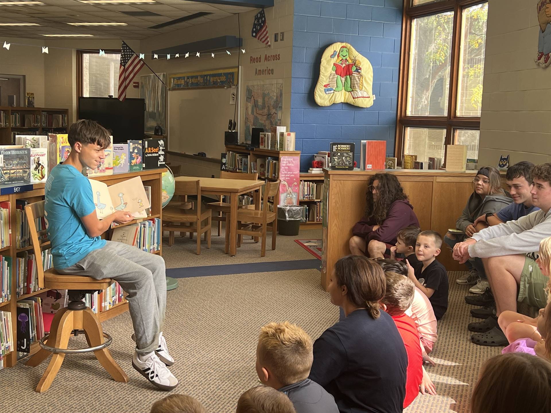 Sharpsville High School students read stories and interact with Sharpsville Elementary School studen