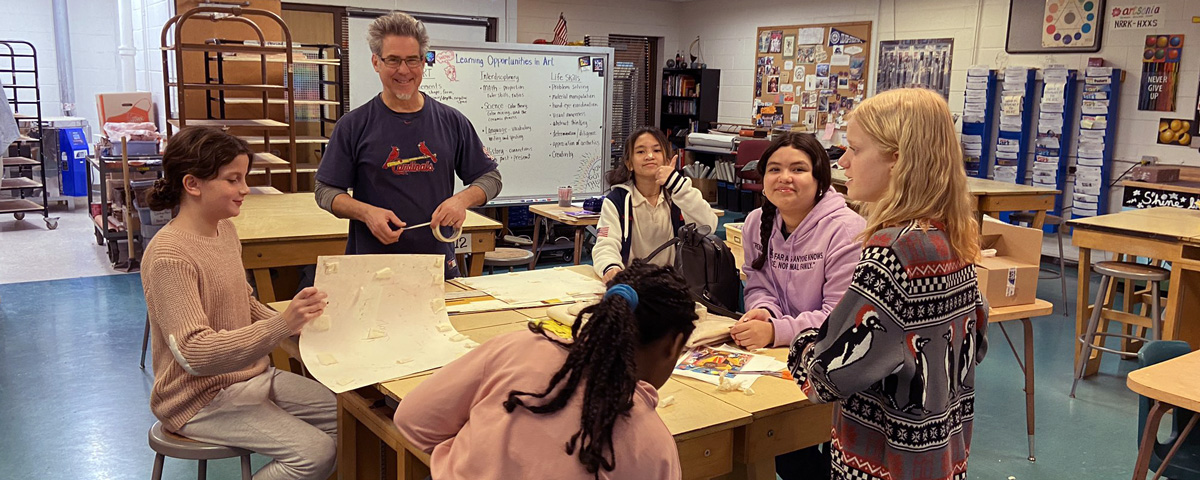 McCracken Art teacher Mr. MacBeth with students in the art room