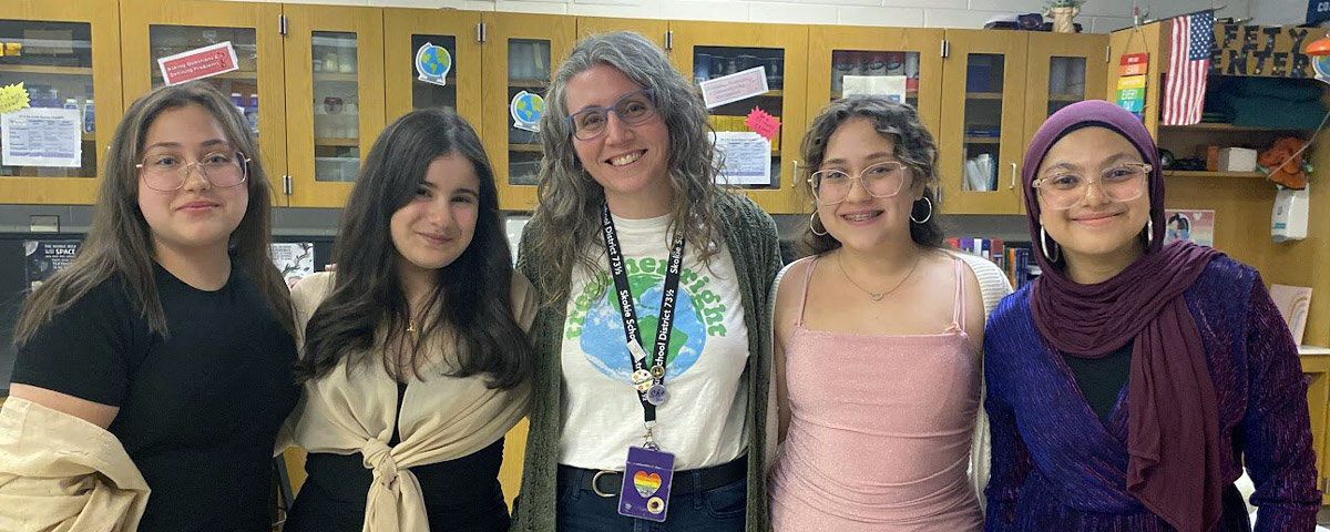 Students with 8th grade Science teacher Mrs. Gormley after their graduation photo shoot