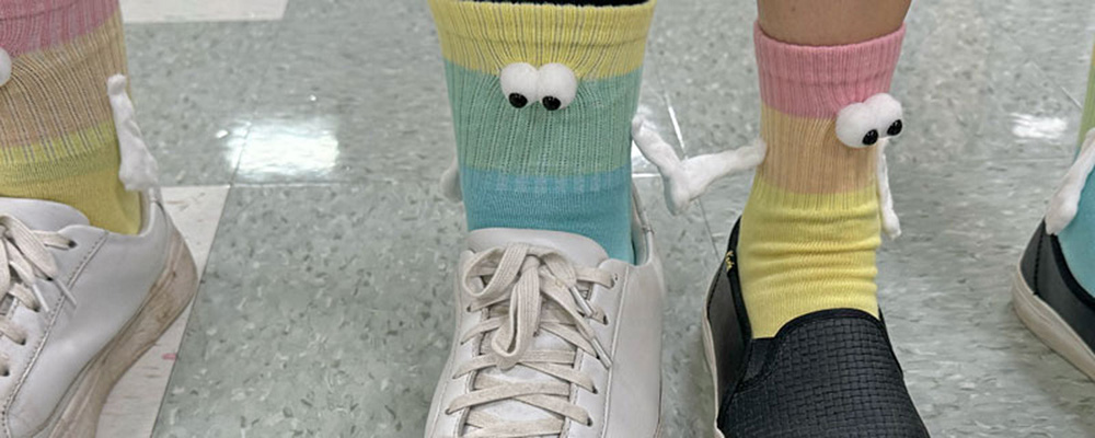 Photo of "hand-holding socks" on feet