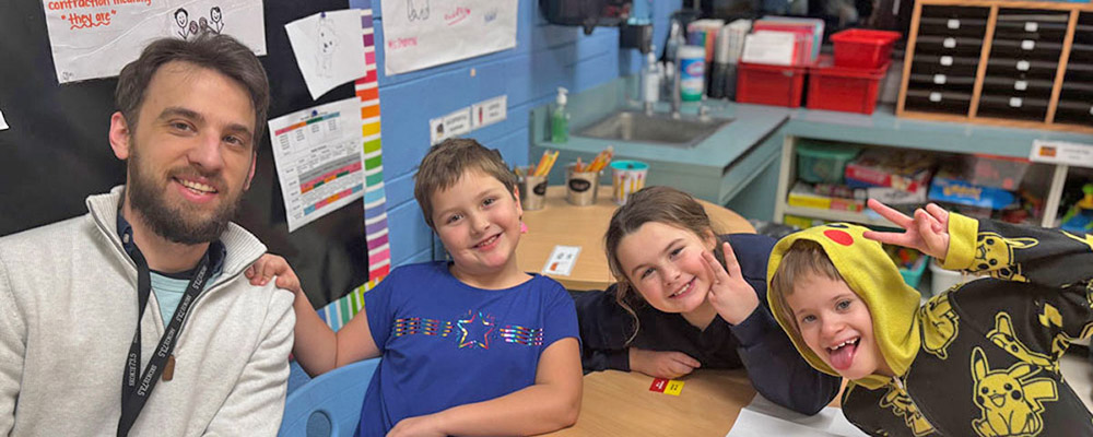 Photo of teacher and students in the classroom
