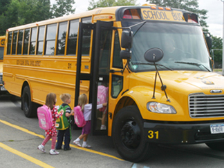 children boarding a yellow school bus