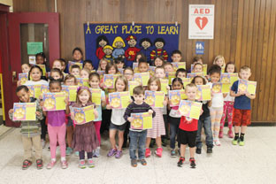 group of students show off their award certificates