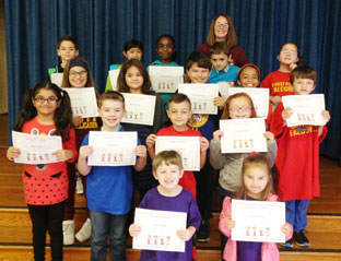 students holding awards