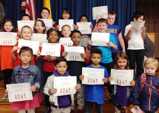 students holding awards