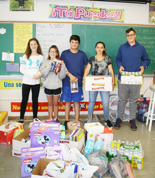 students holding packages