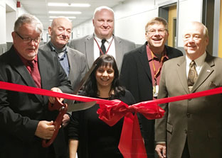 Board of ed members cut ribbon on new high school wing