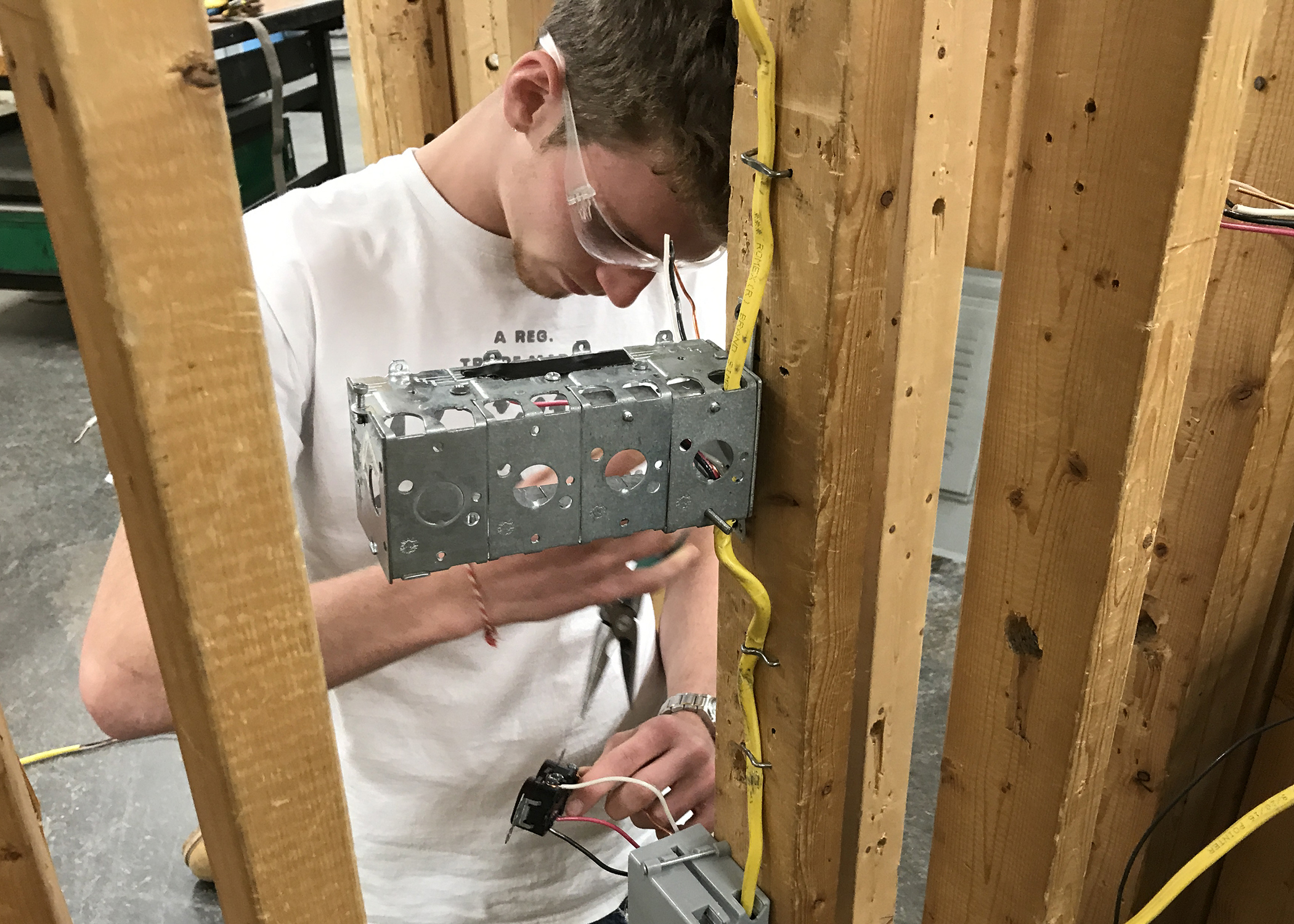 Students works on an electrical box