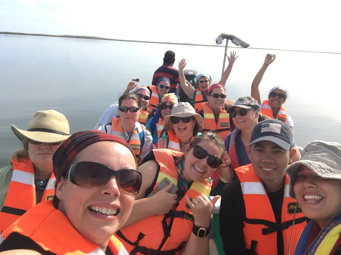 Group of teachers on a boat at sea