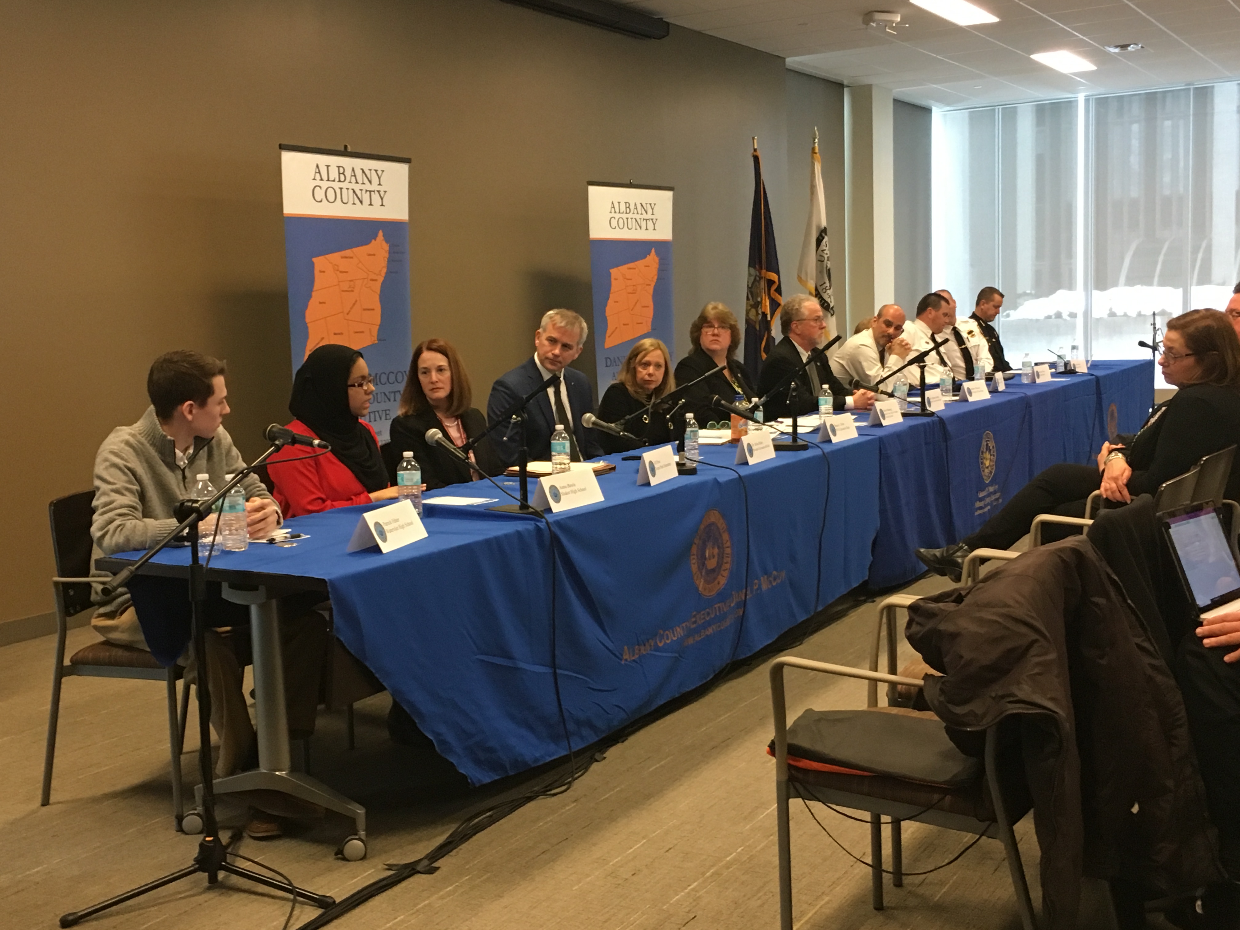 a long table with panelists sitting at it