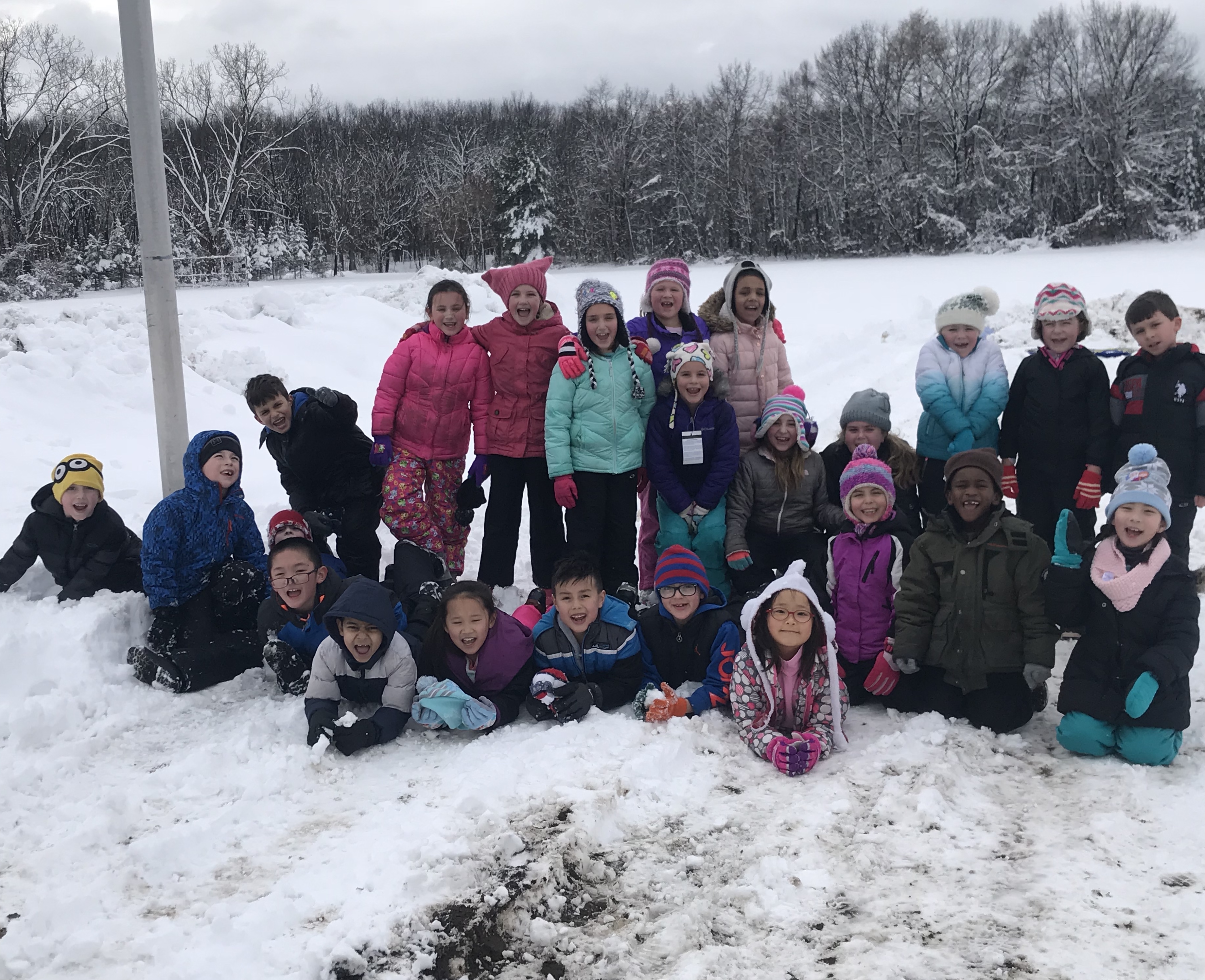 group of students in their winter clothes outside