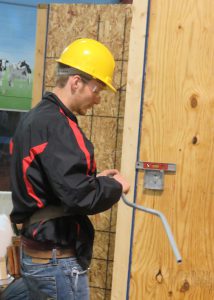 student works on an electrical box