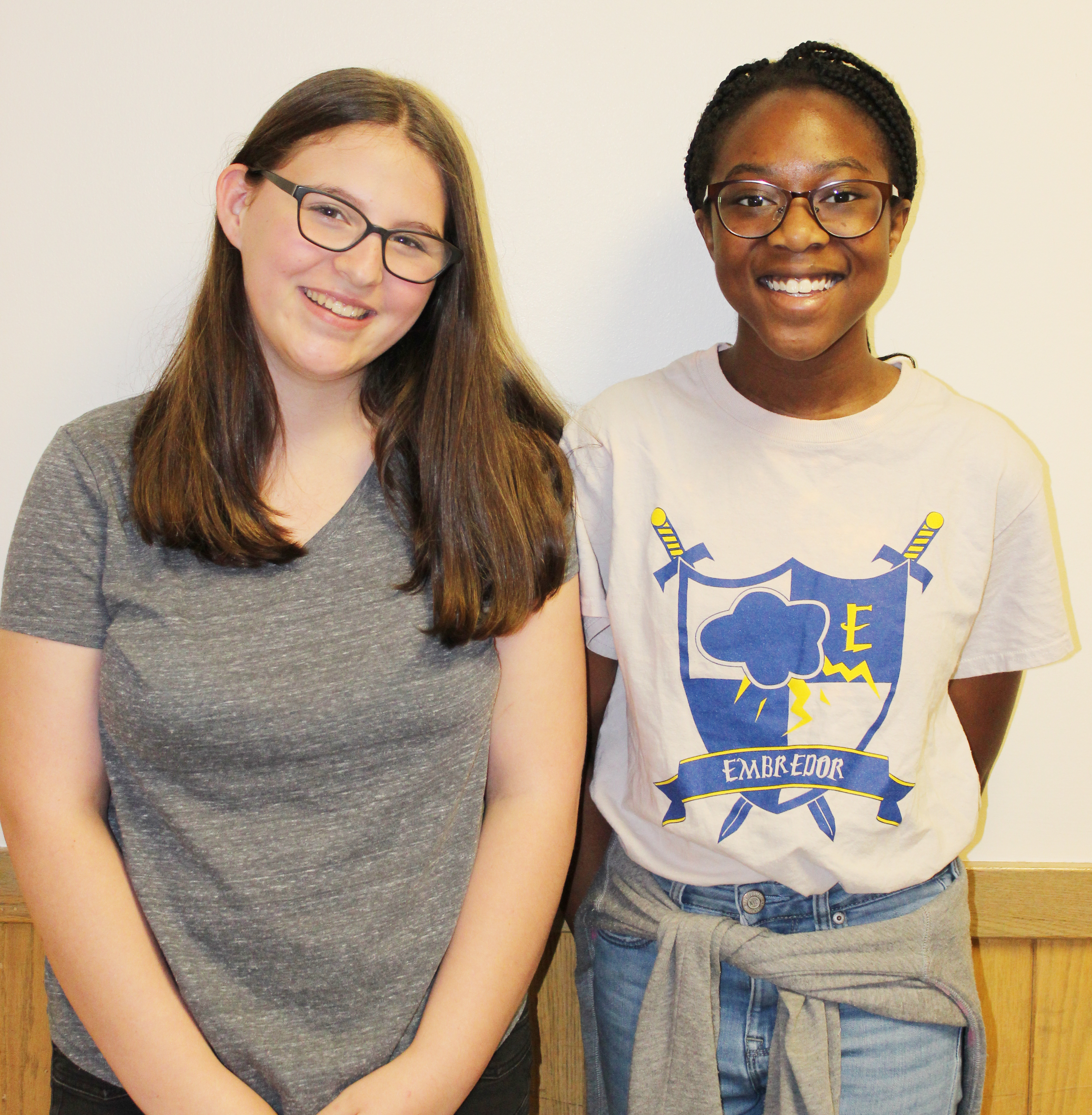 two girls pose for camera