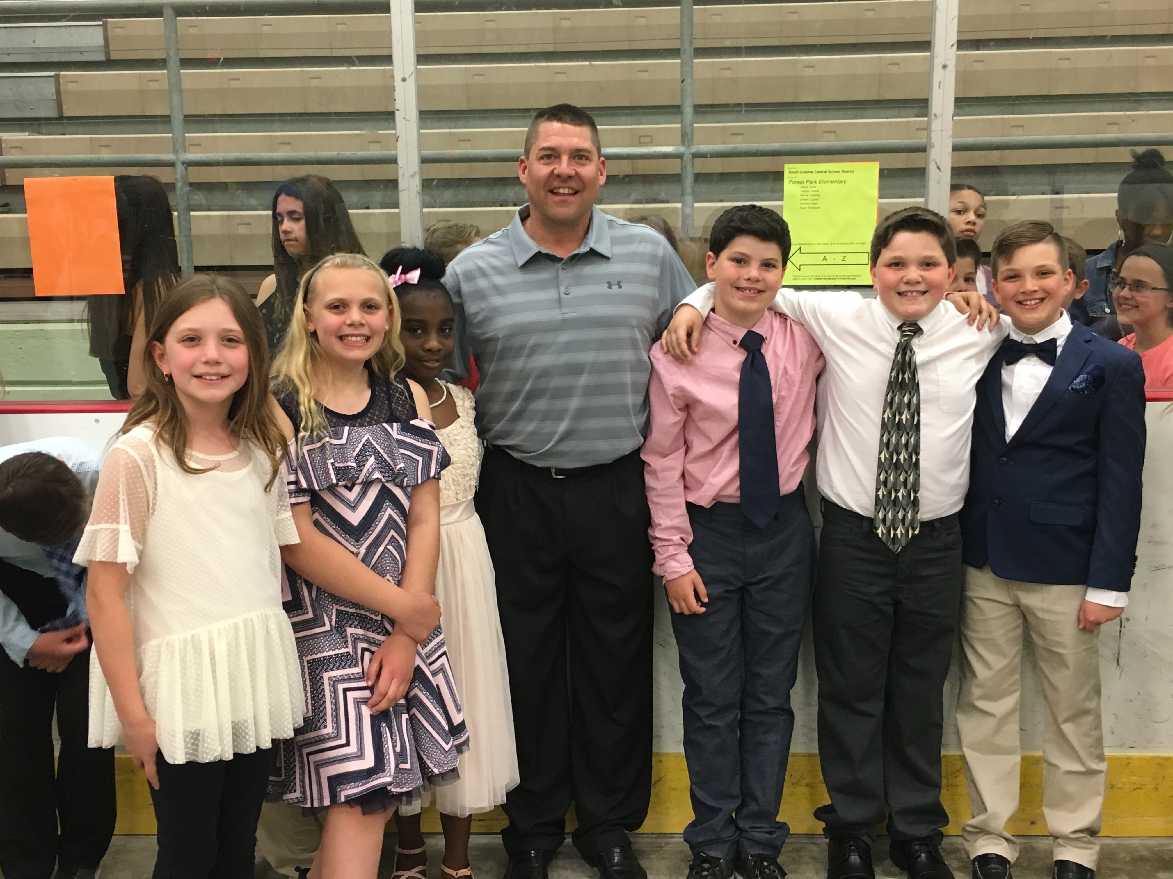 5 award winners pose with their coach