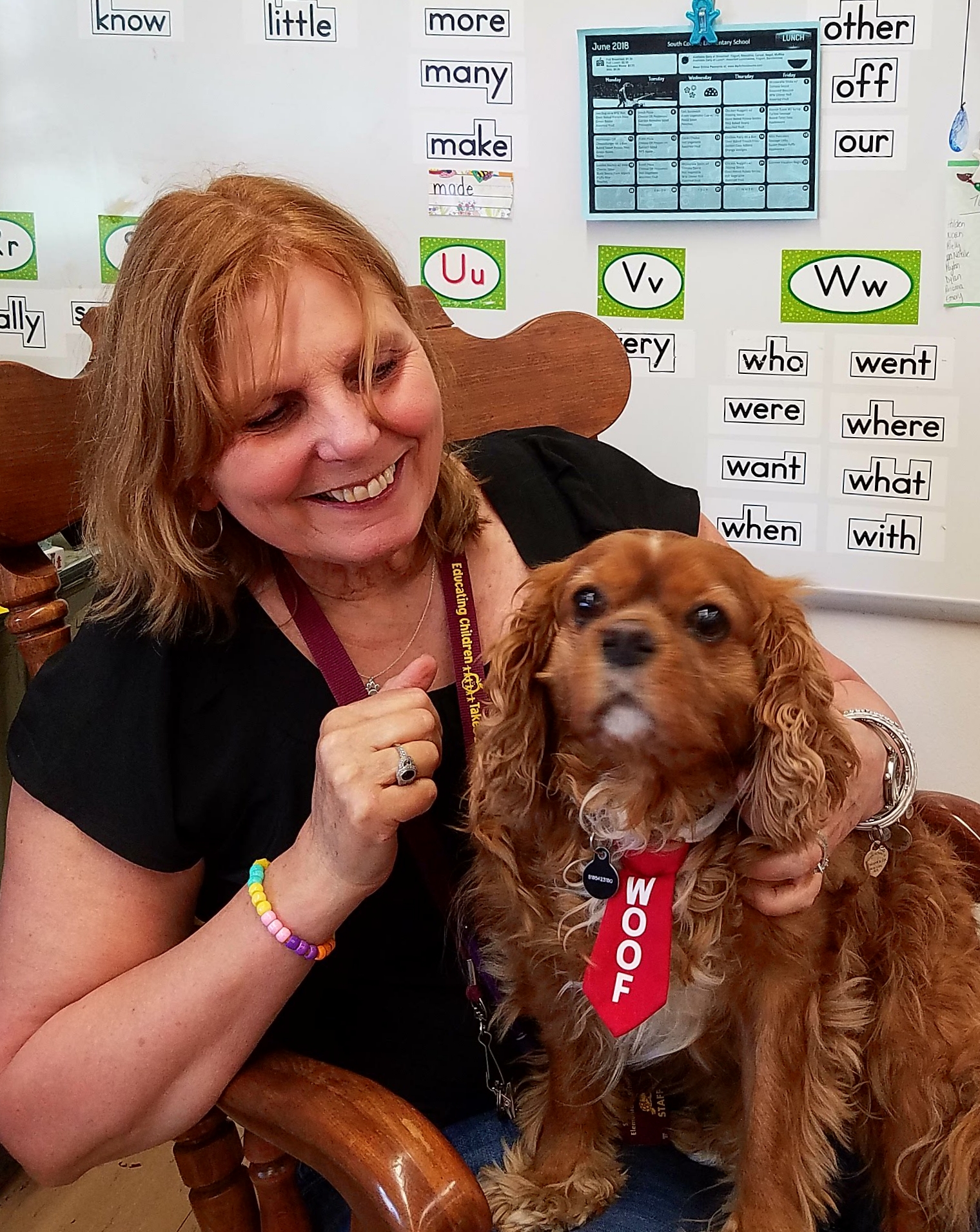 Ollie the therapy dog with her owner