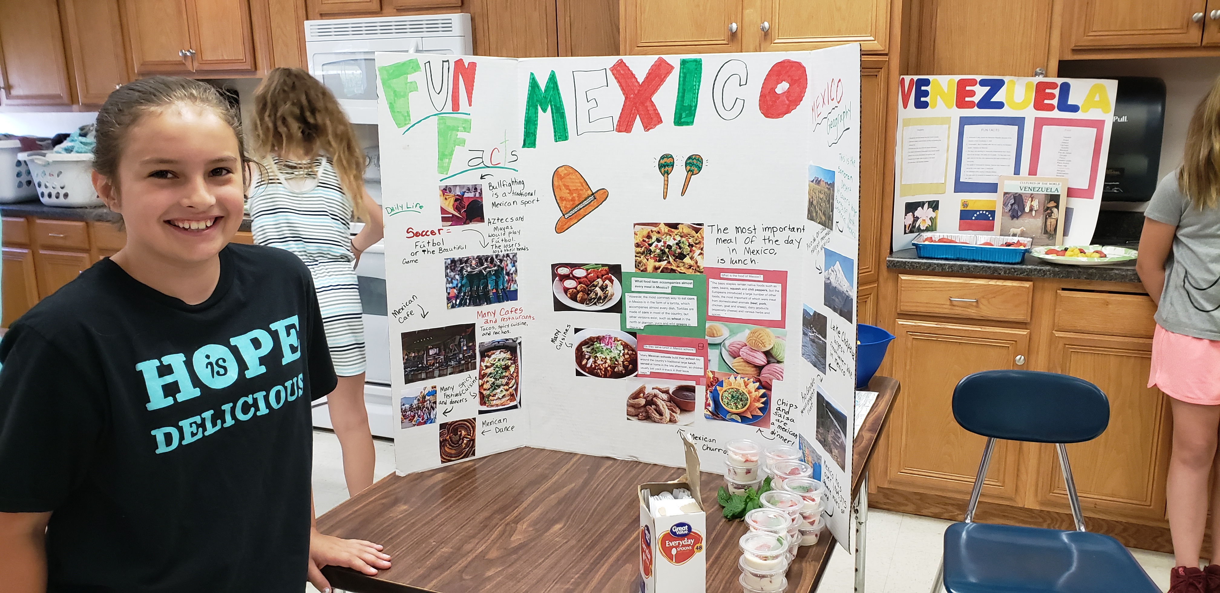 a girl shows her table display of Mexico