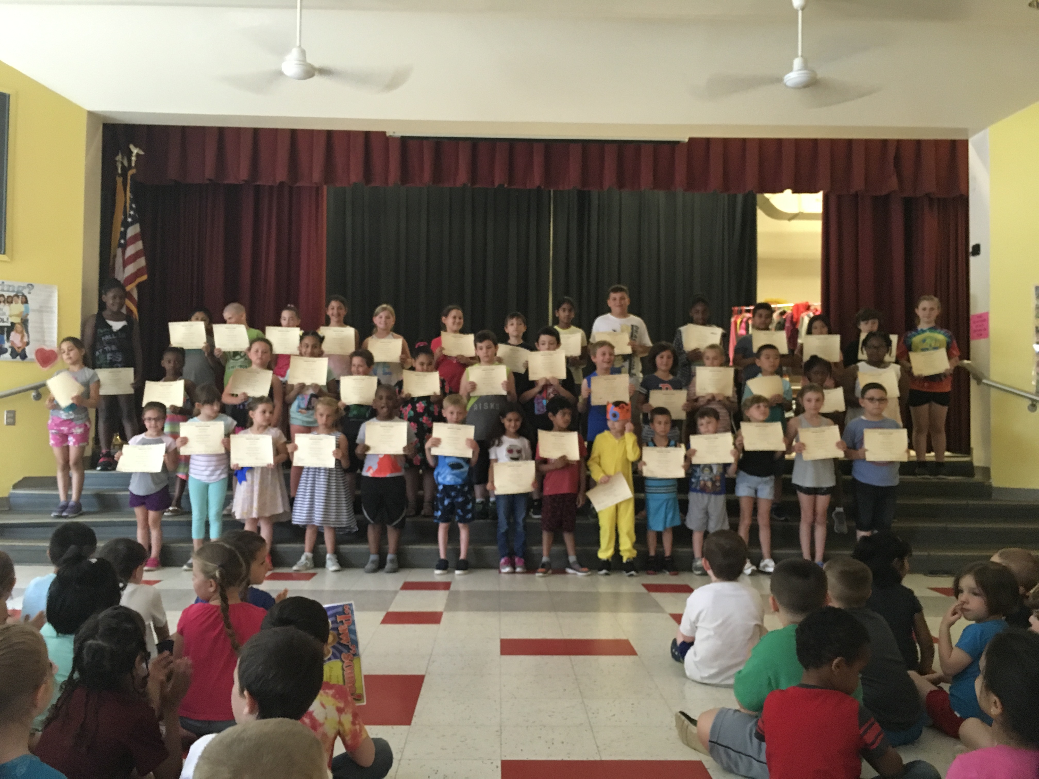 award winners show off their certificates