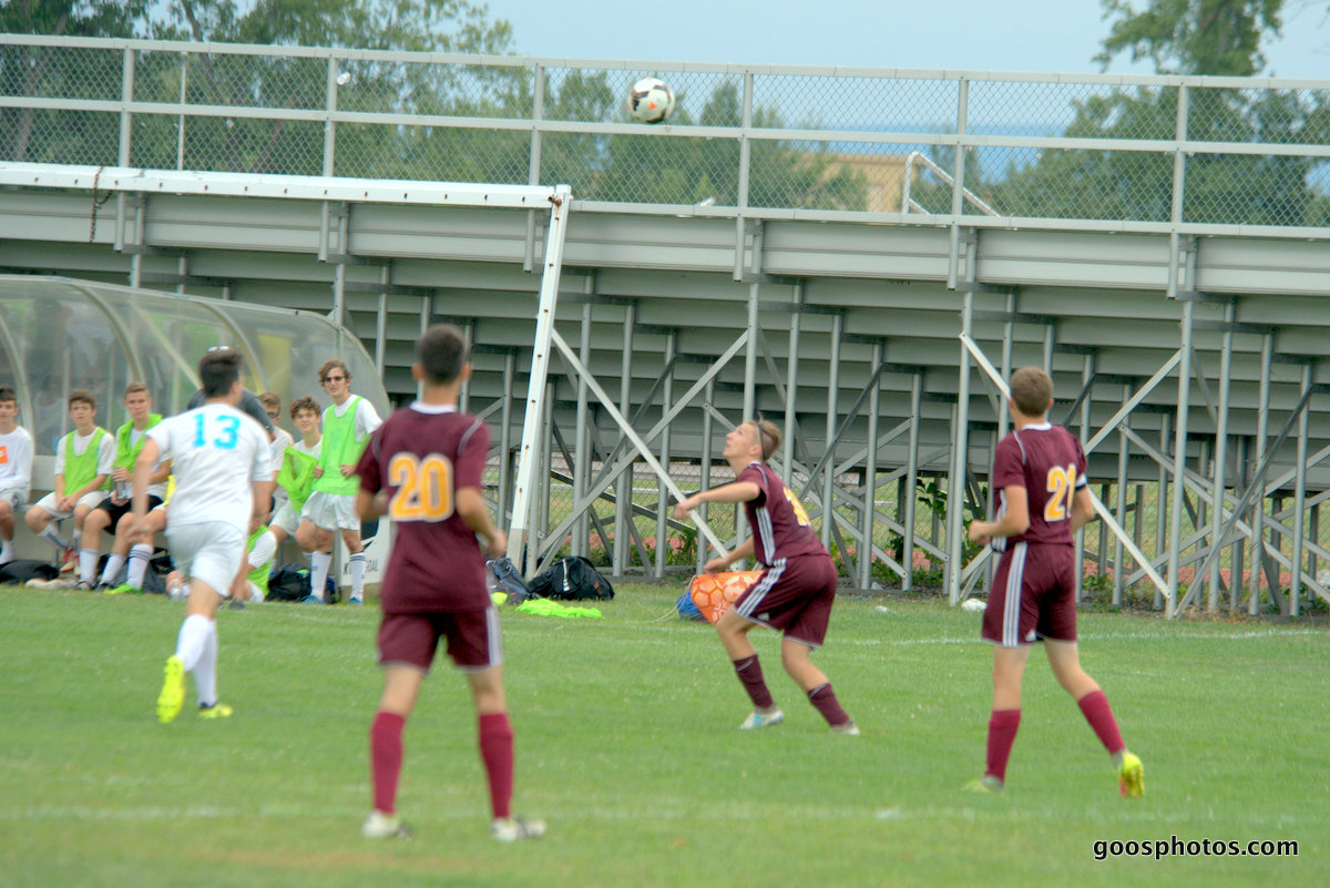 boy dribbles a soccer Ball in a game