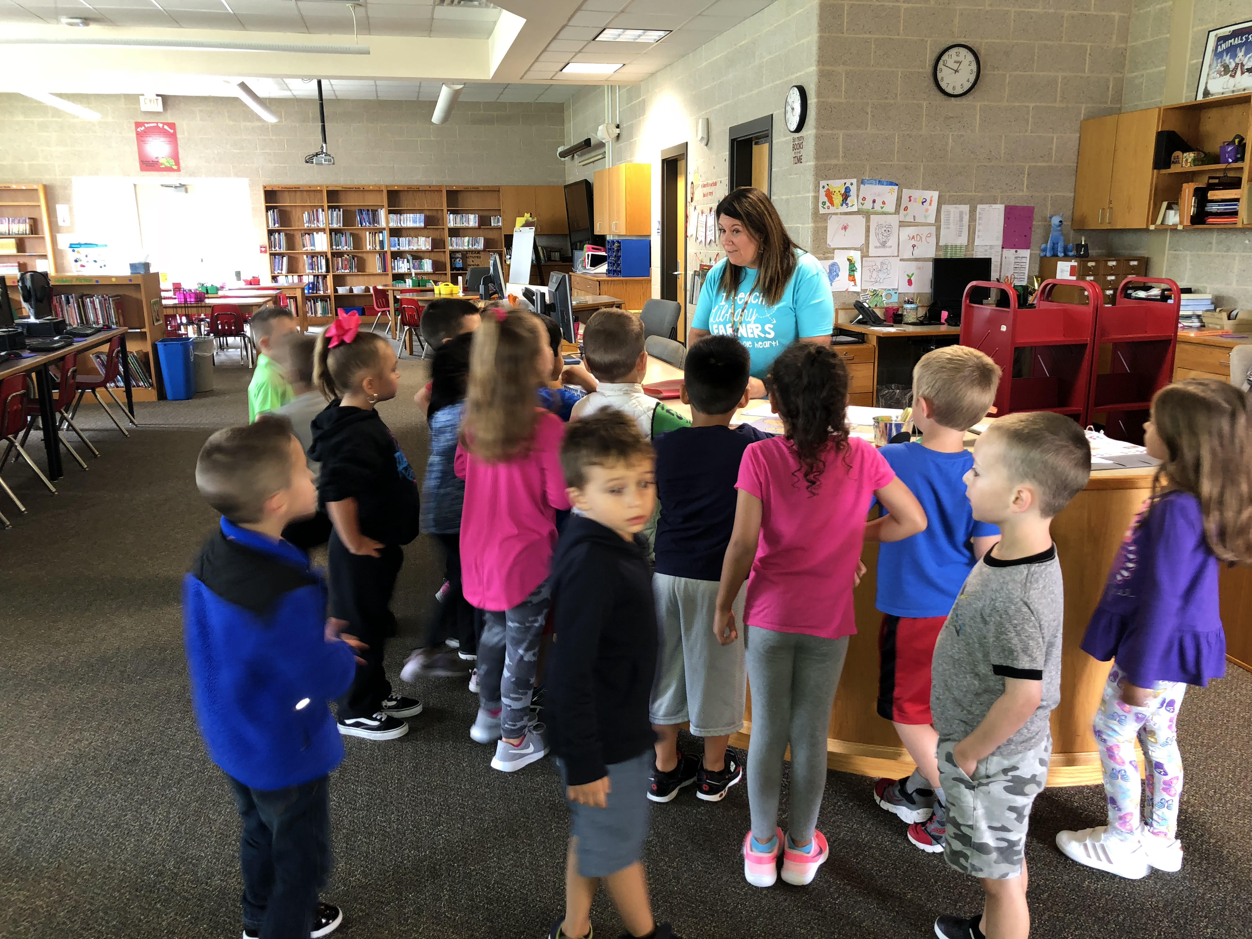 students surround their principal