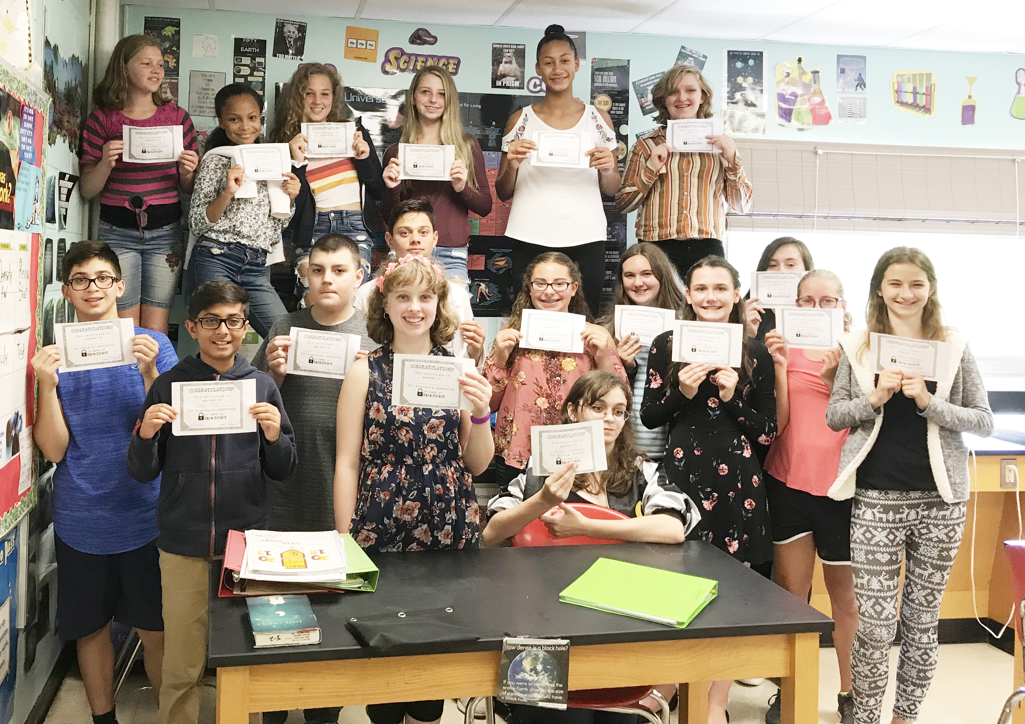 large group of students showing their award certificates