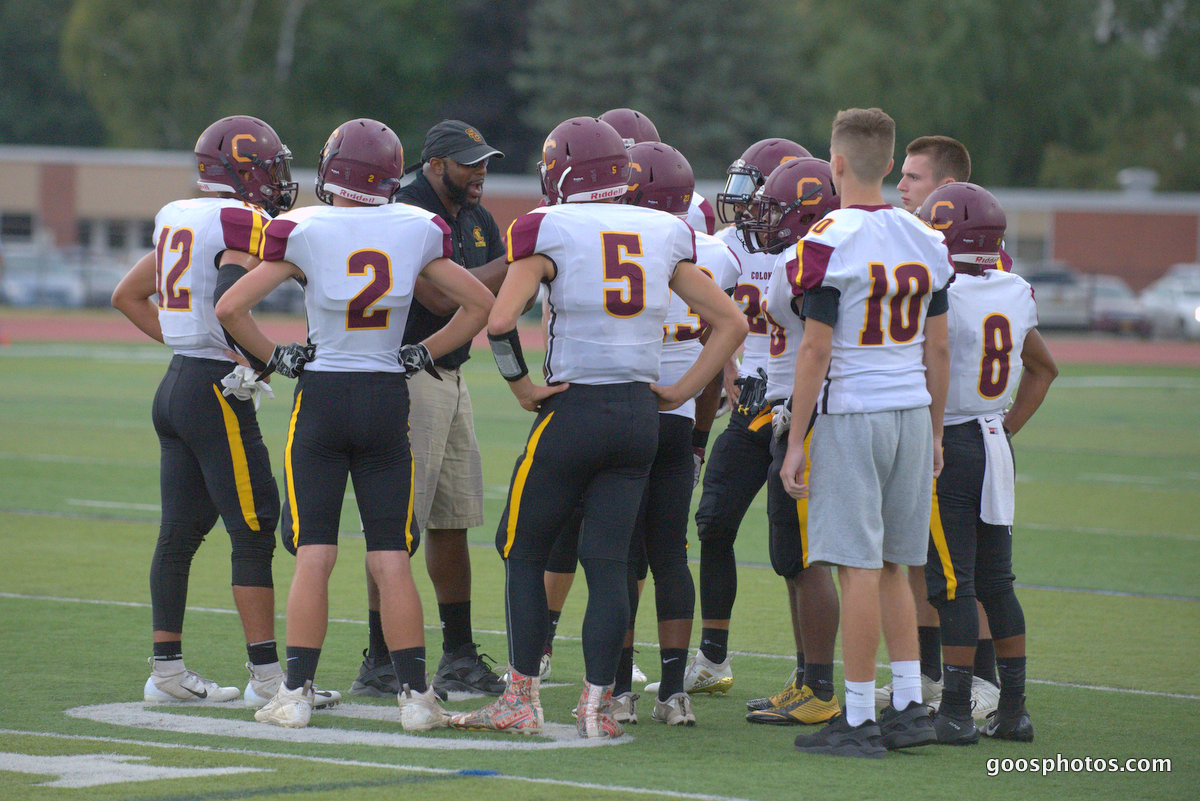 football team in a huddle