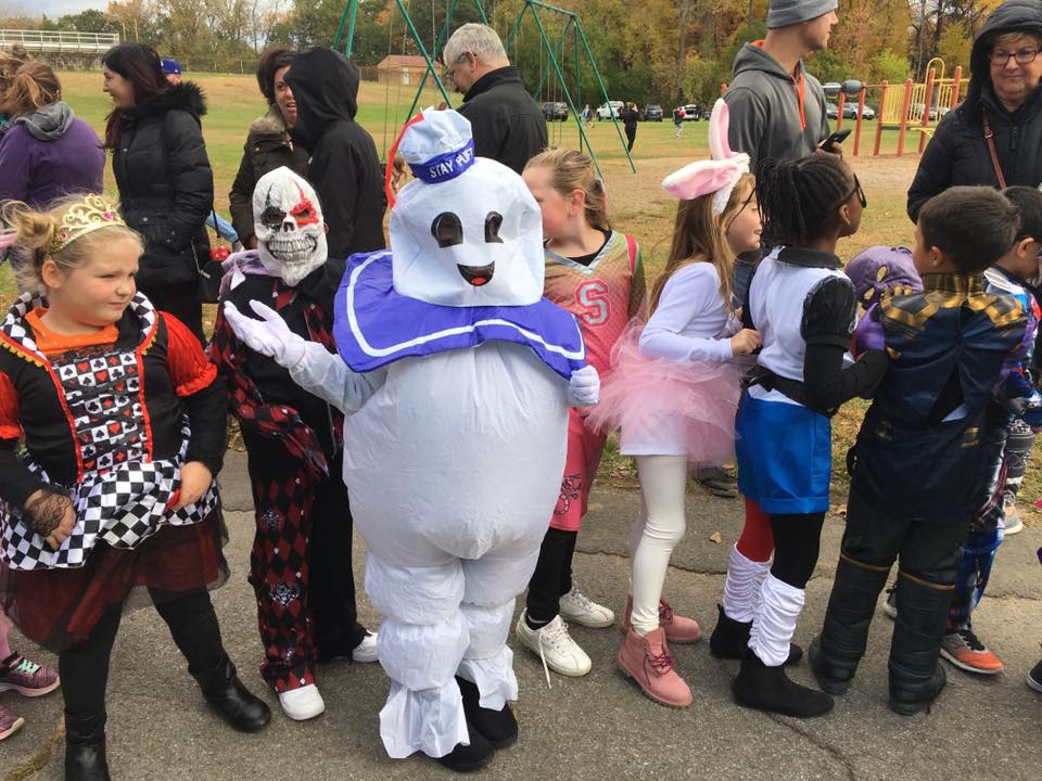 giant marshmallow man leads halloween parade