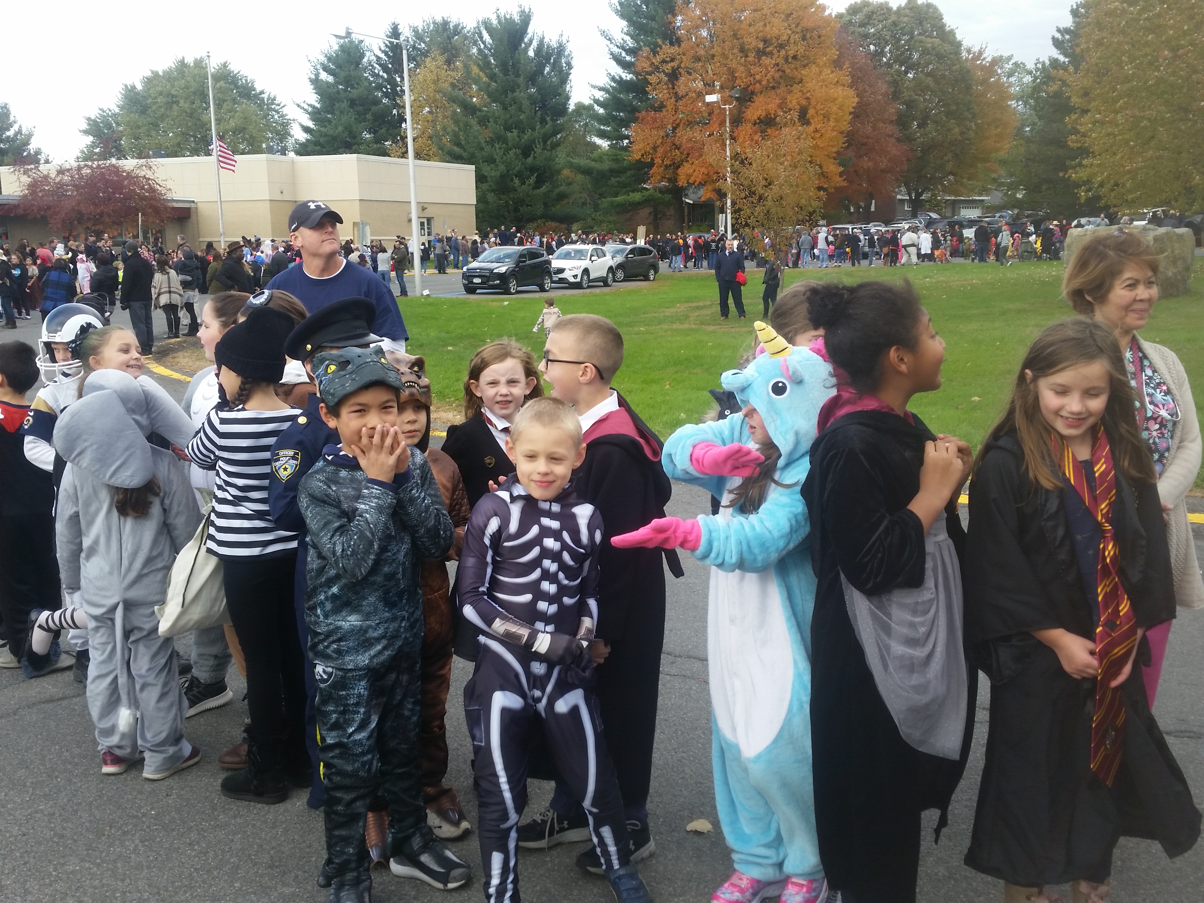 children dress in costume and march in halloween parade