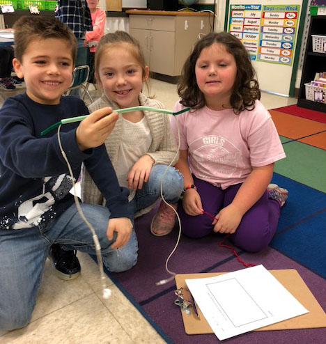 3 children work on a project together