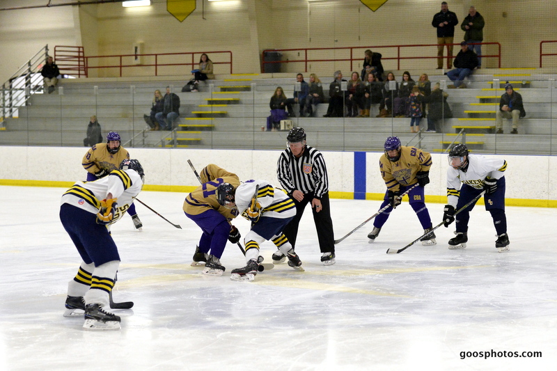 hockey teams face off at center ice