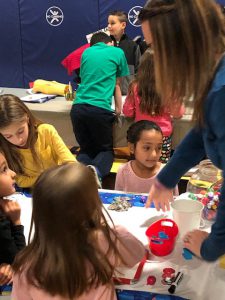 students work on a project together at a large table