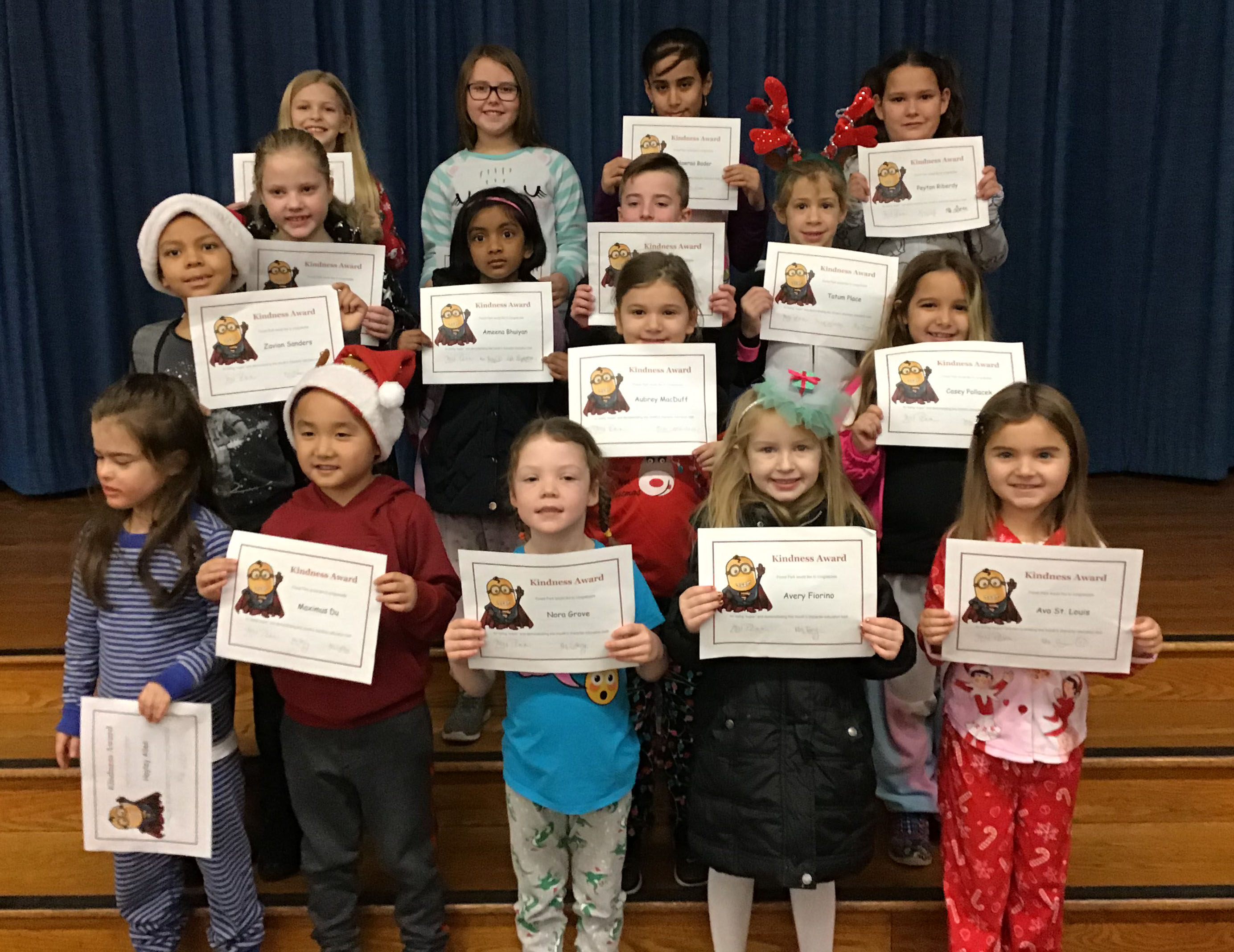 students show off their kindness certificates