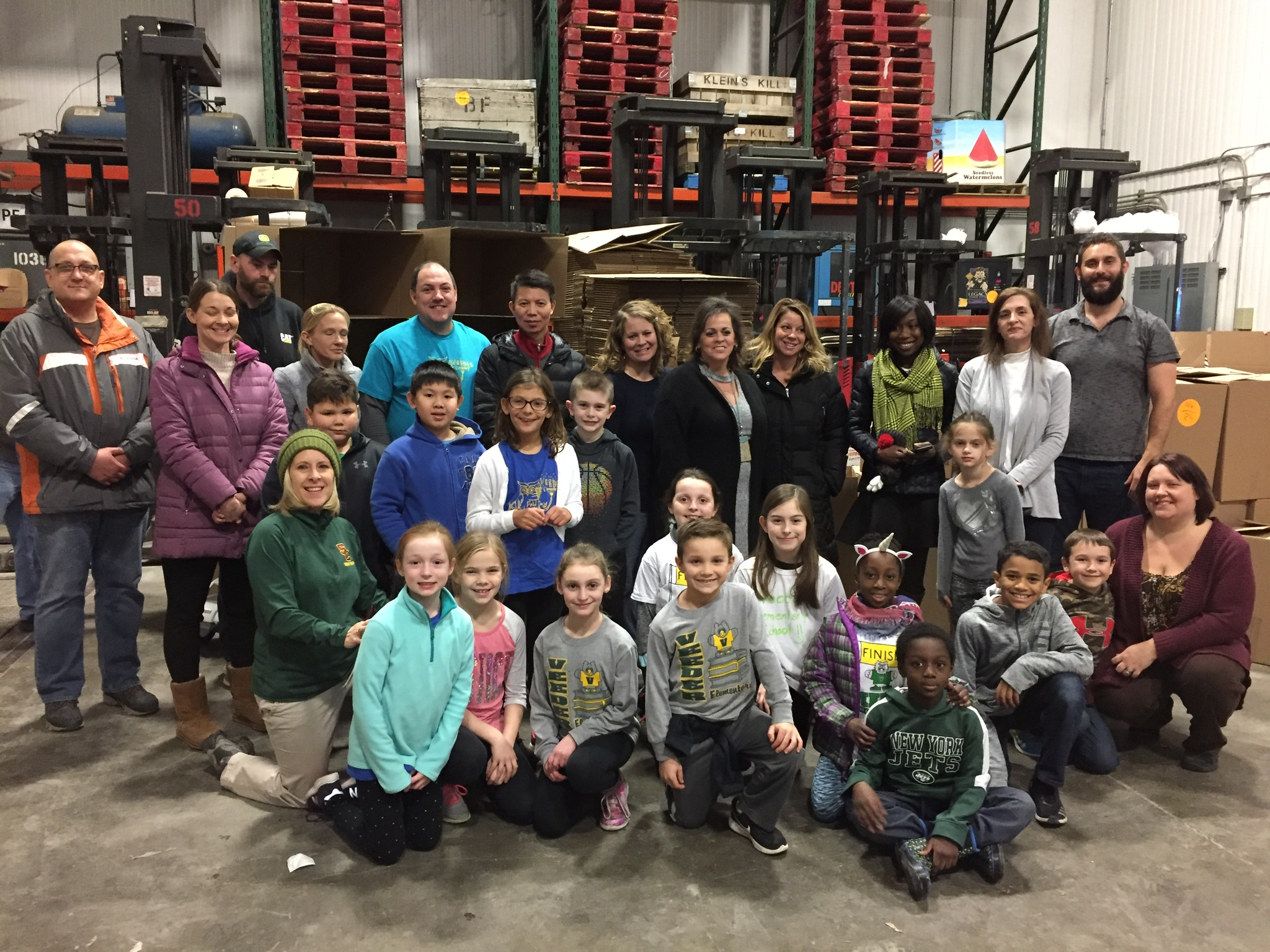 large group of students gather at the food bank