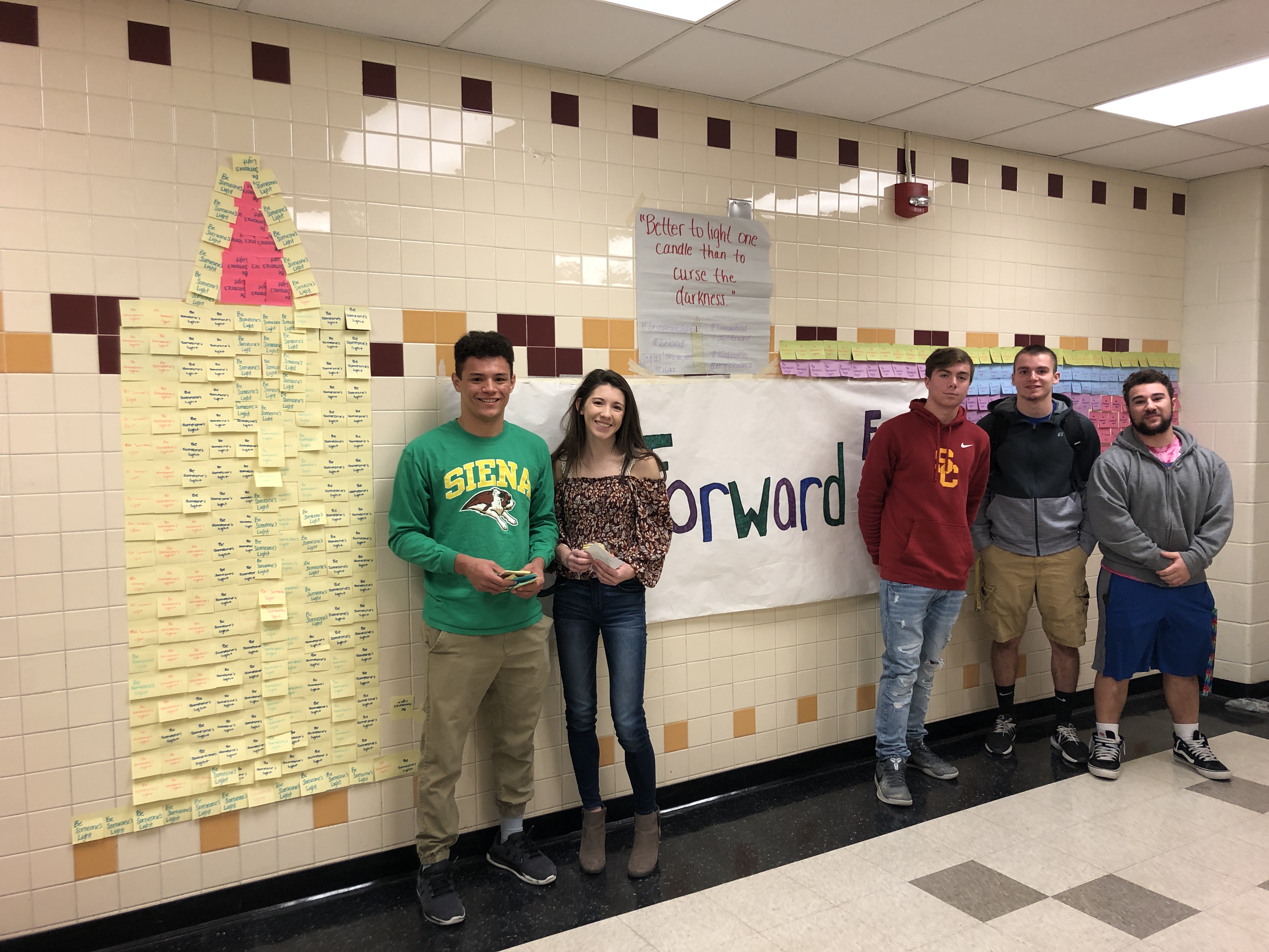 students show off their kindness wall