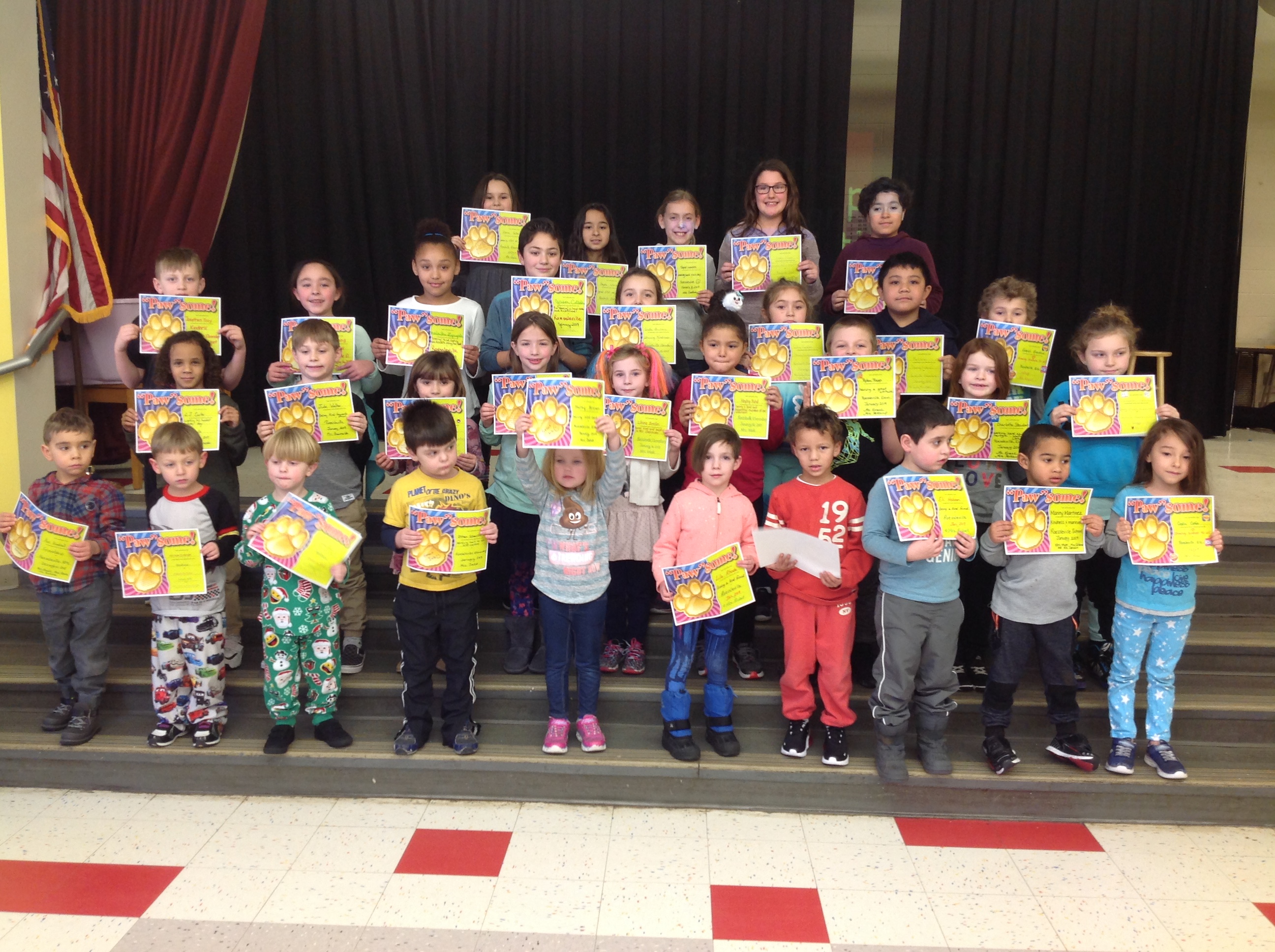 group of students with their award certificates