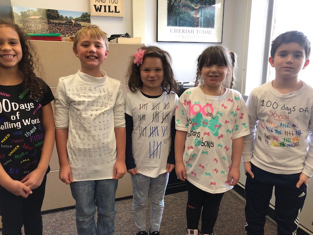 4 kids show off their 100 day shirts