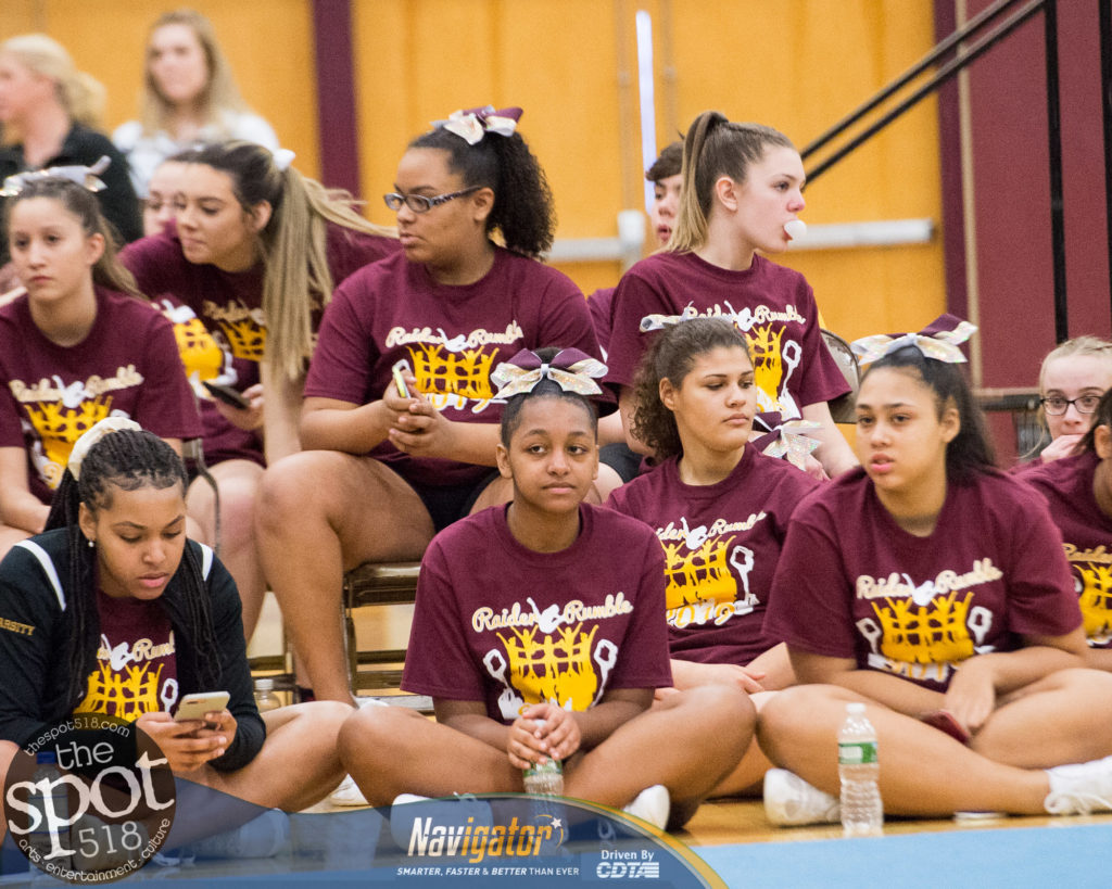 cheerleaders sitting on the floor