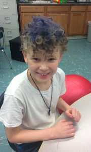 boy with curly multi colored hair