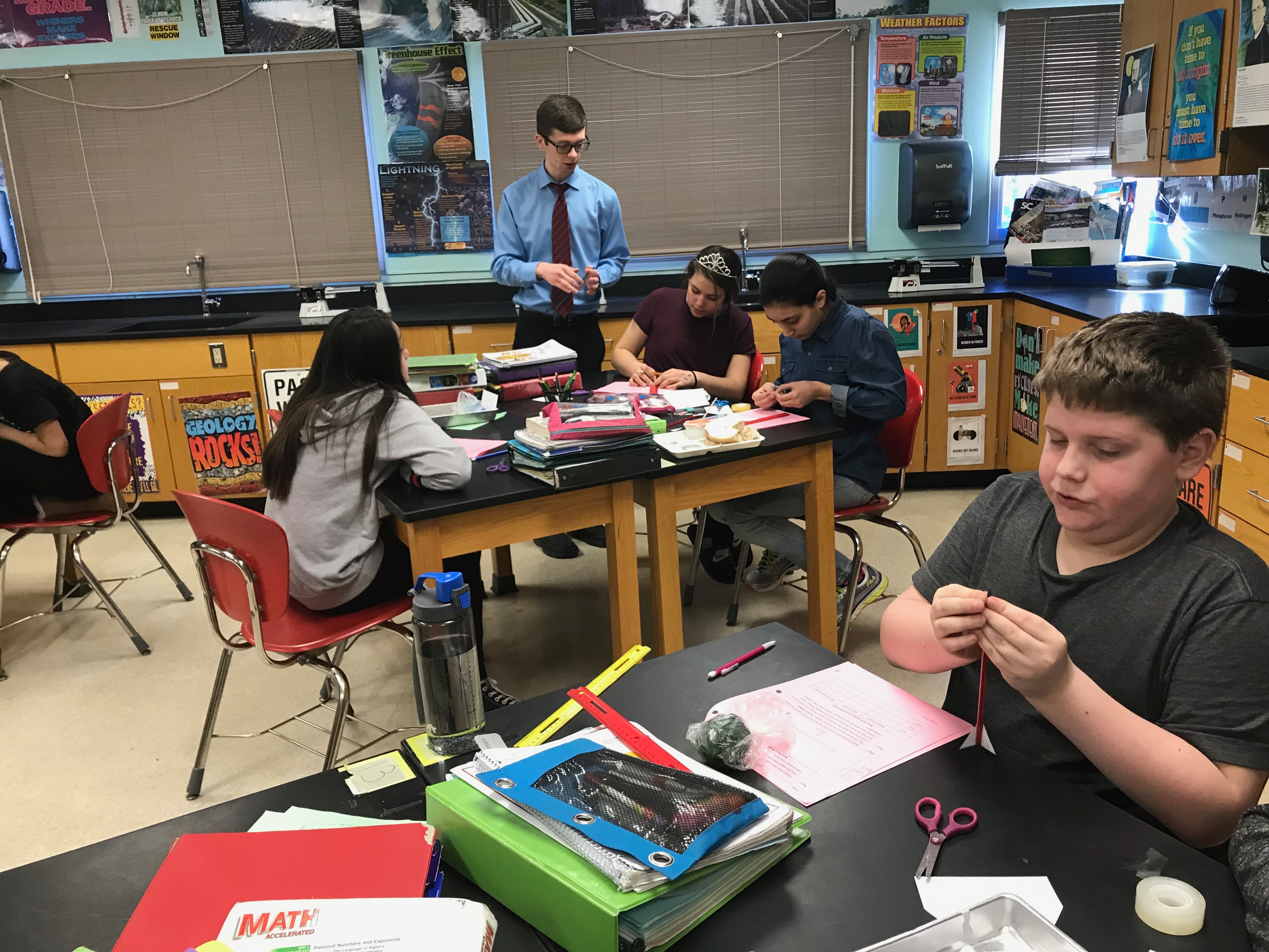 students build rockets at their desks