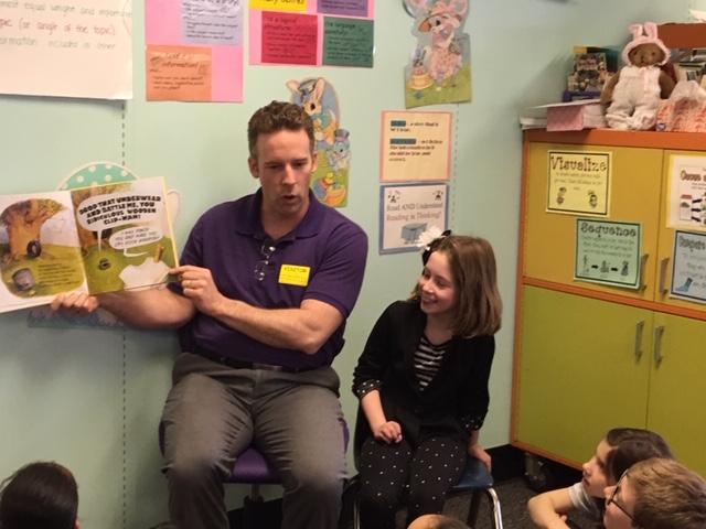 reader shows off book with his daughter