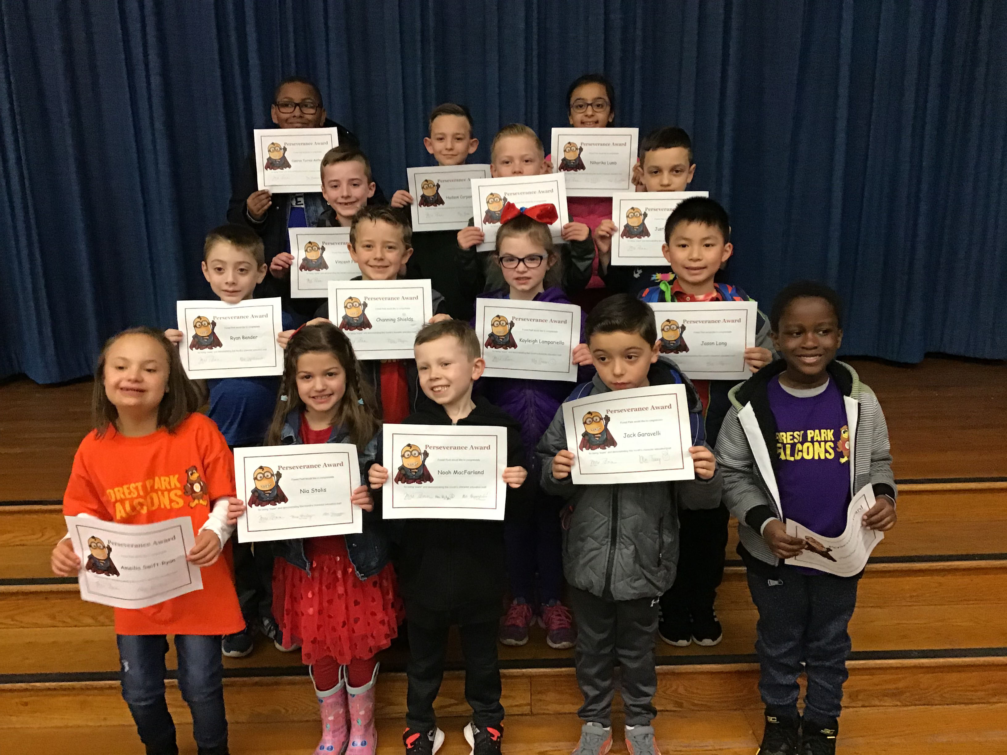 group of students hold their award certificates