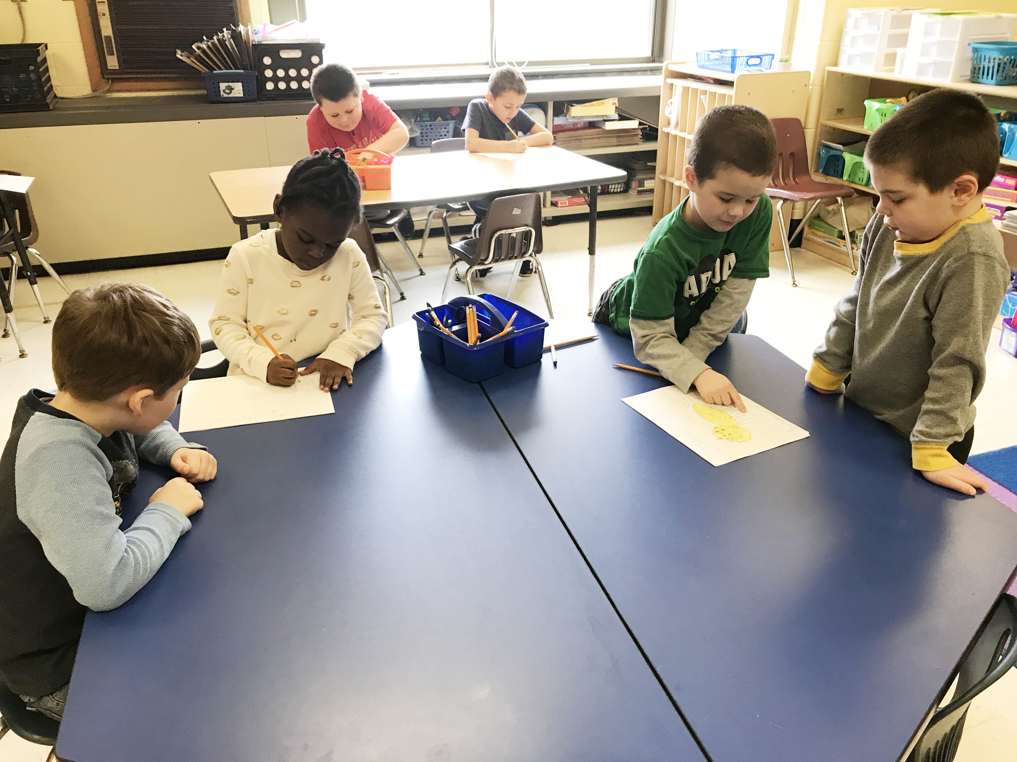 group of student write together at a table