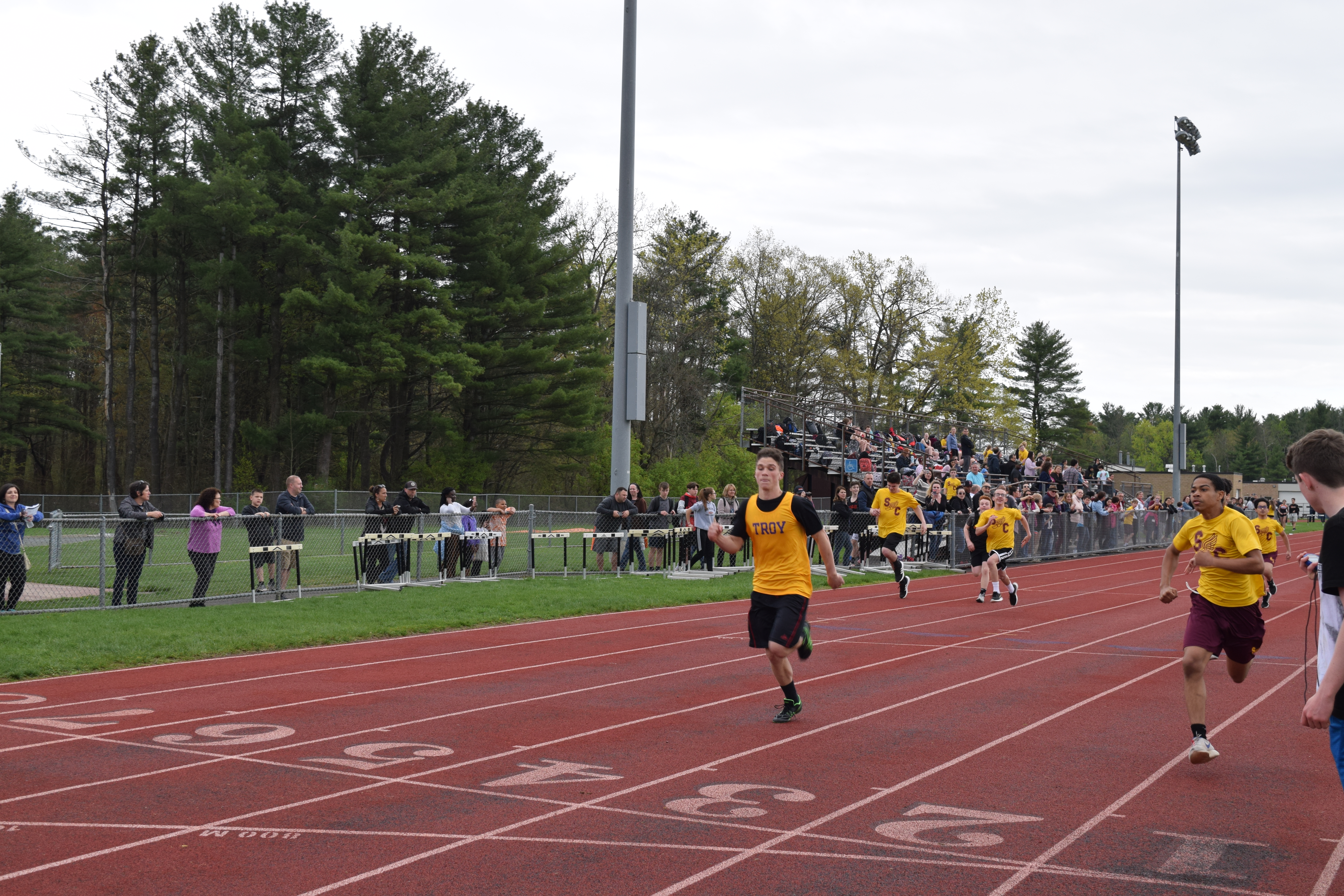 modified track runner boy crosses the finish line