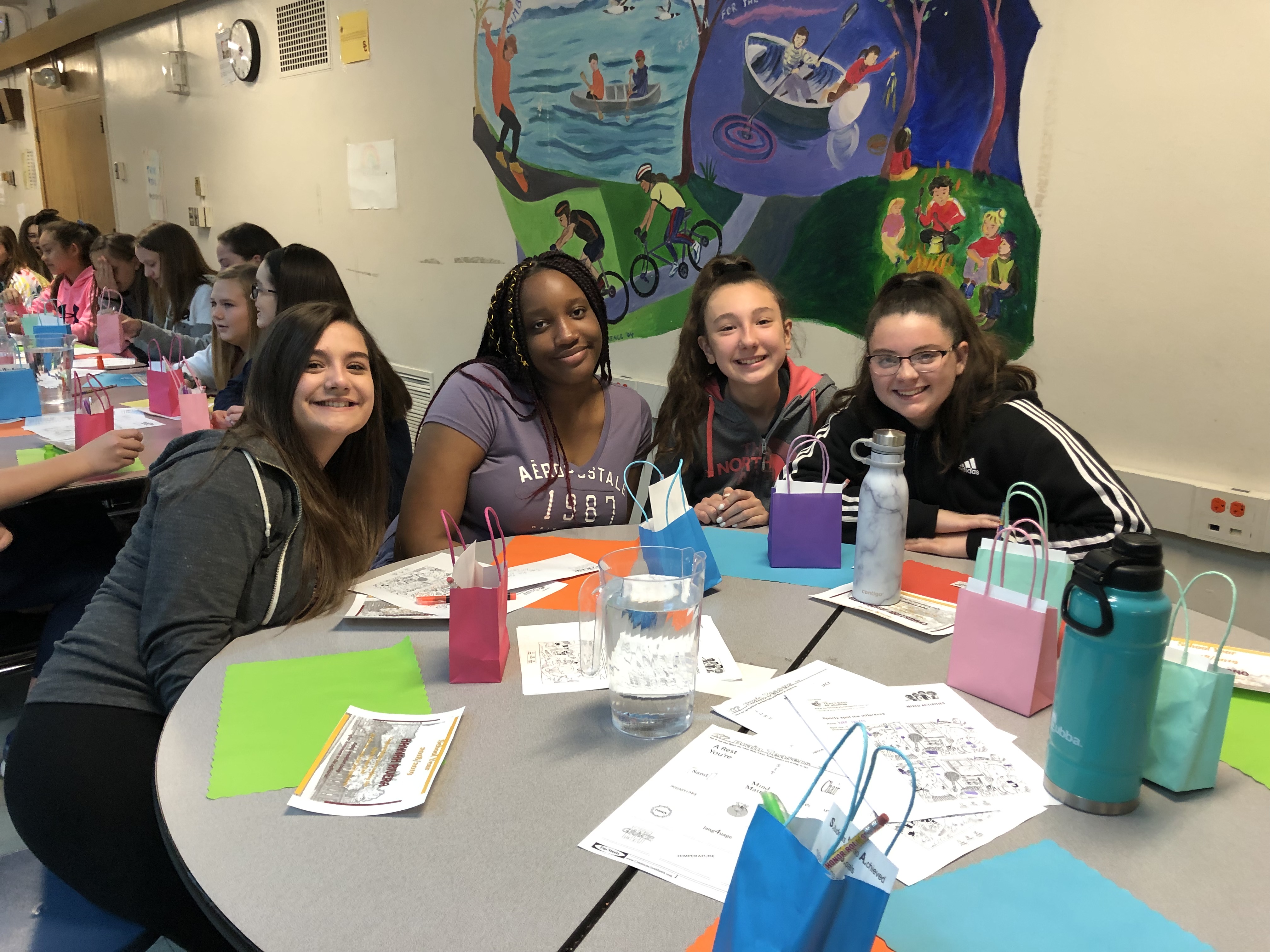 4 girls at a cafeteria table