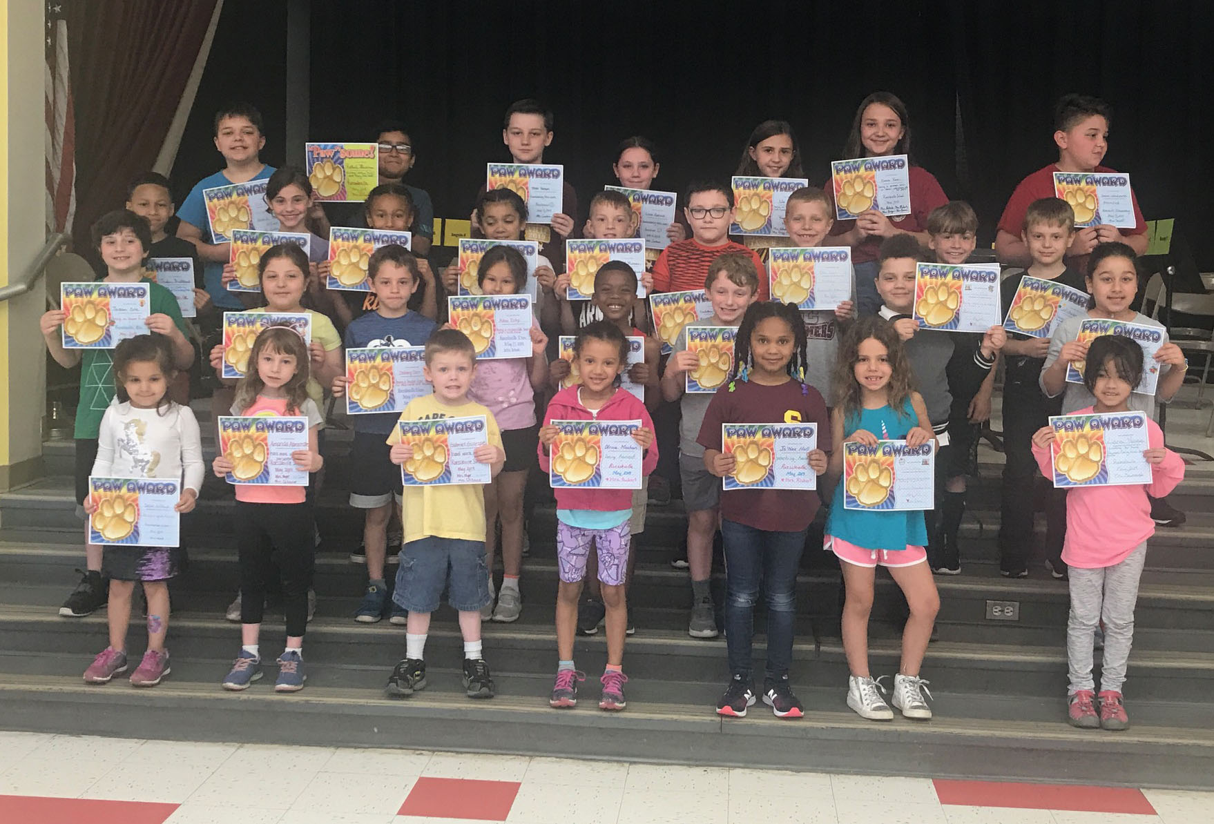 group of students showing their award certificates