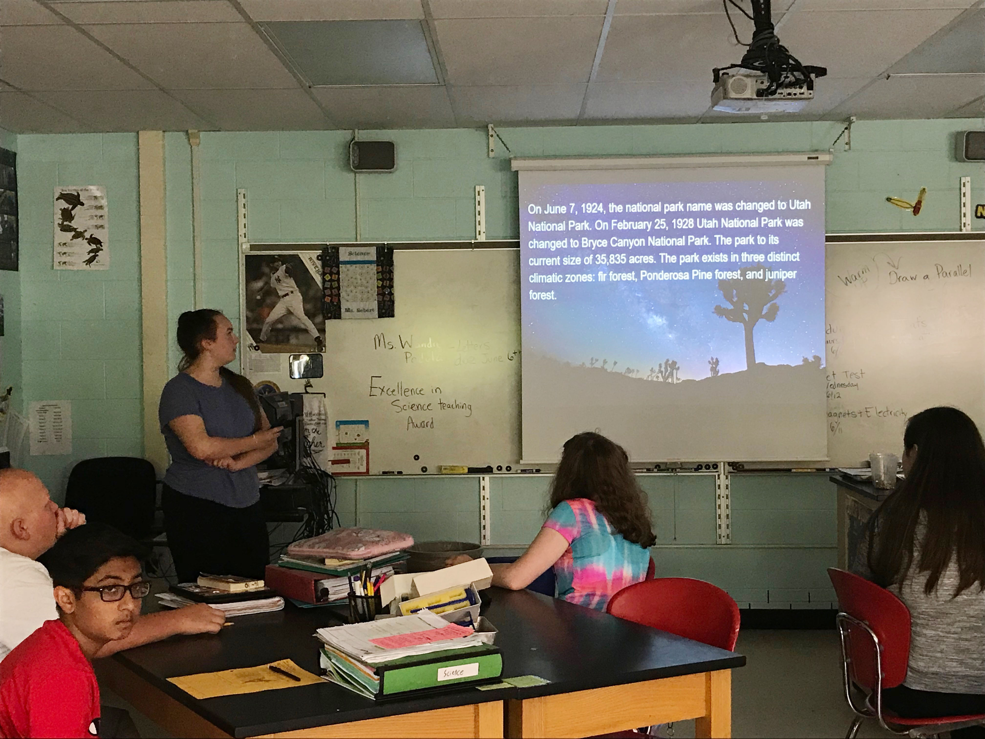 student presents on screen before the class