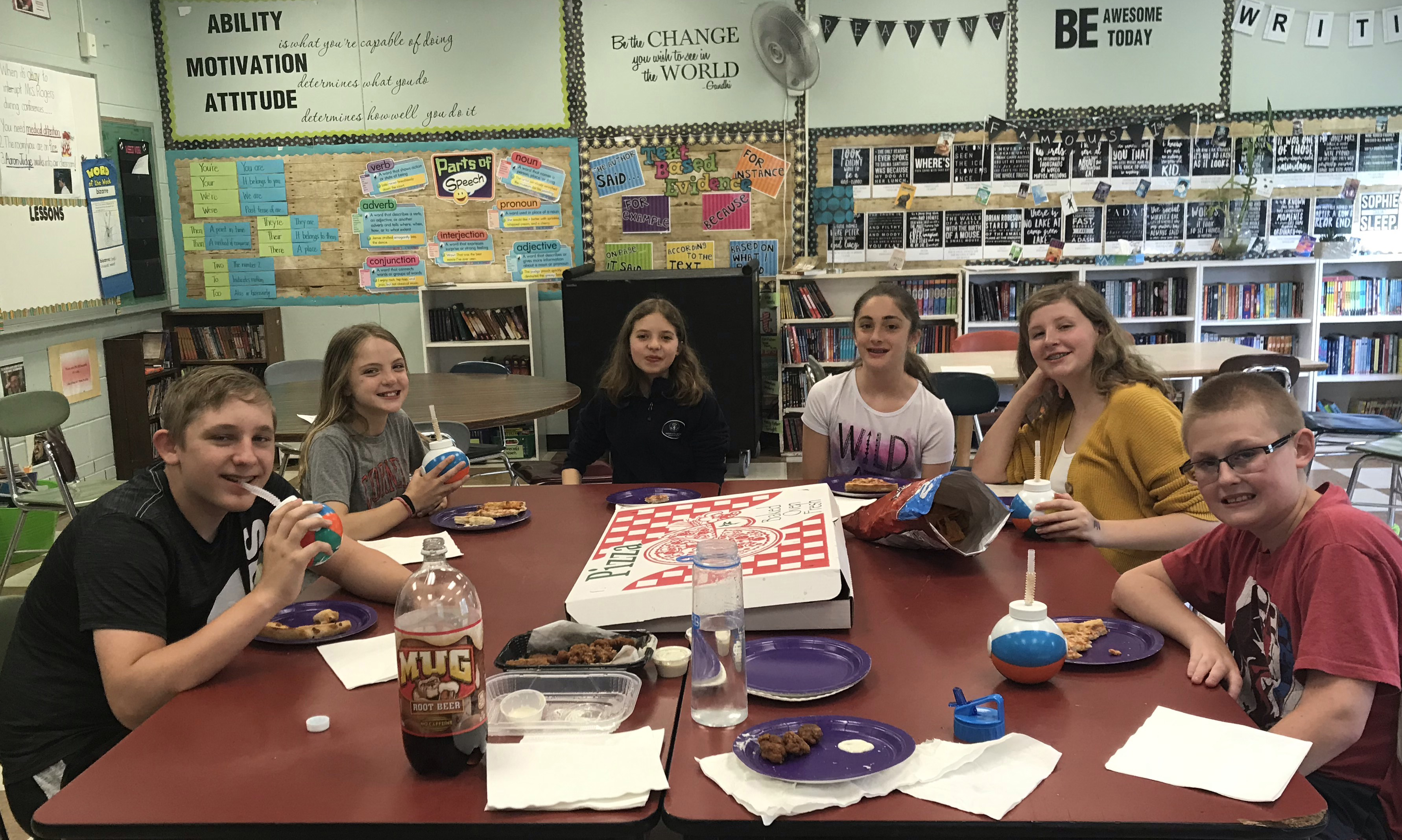 6 students enjoy a pizza party