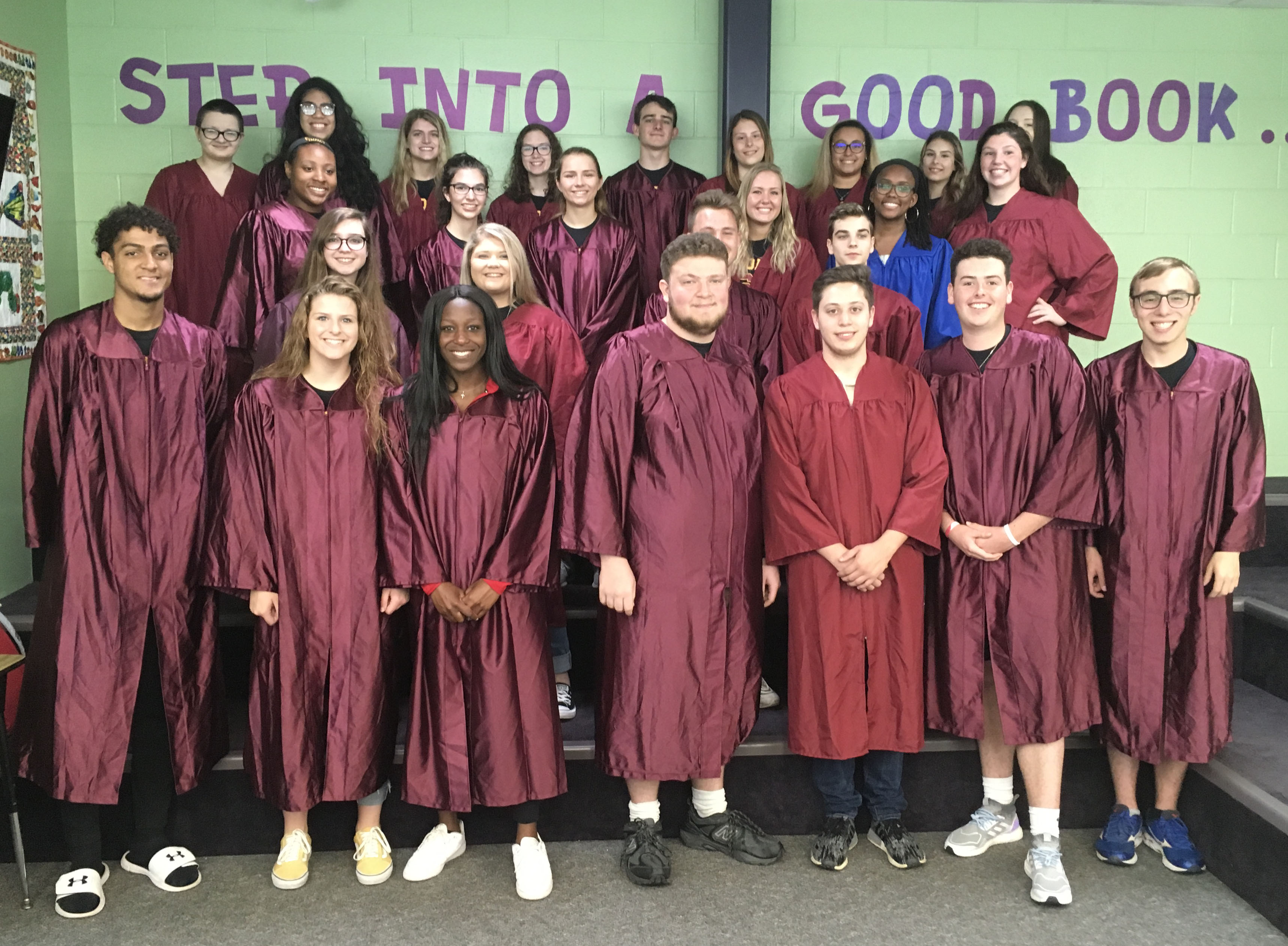 group of high school students in their graduation gowns